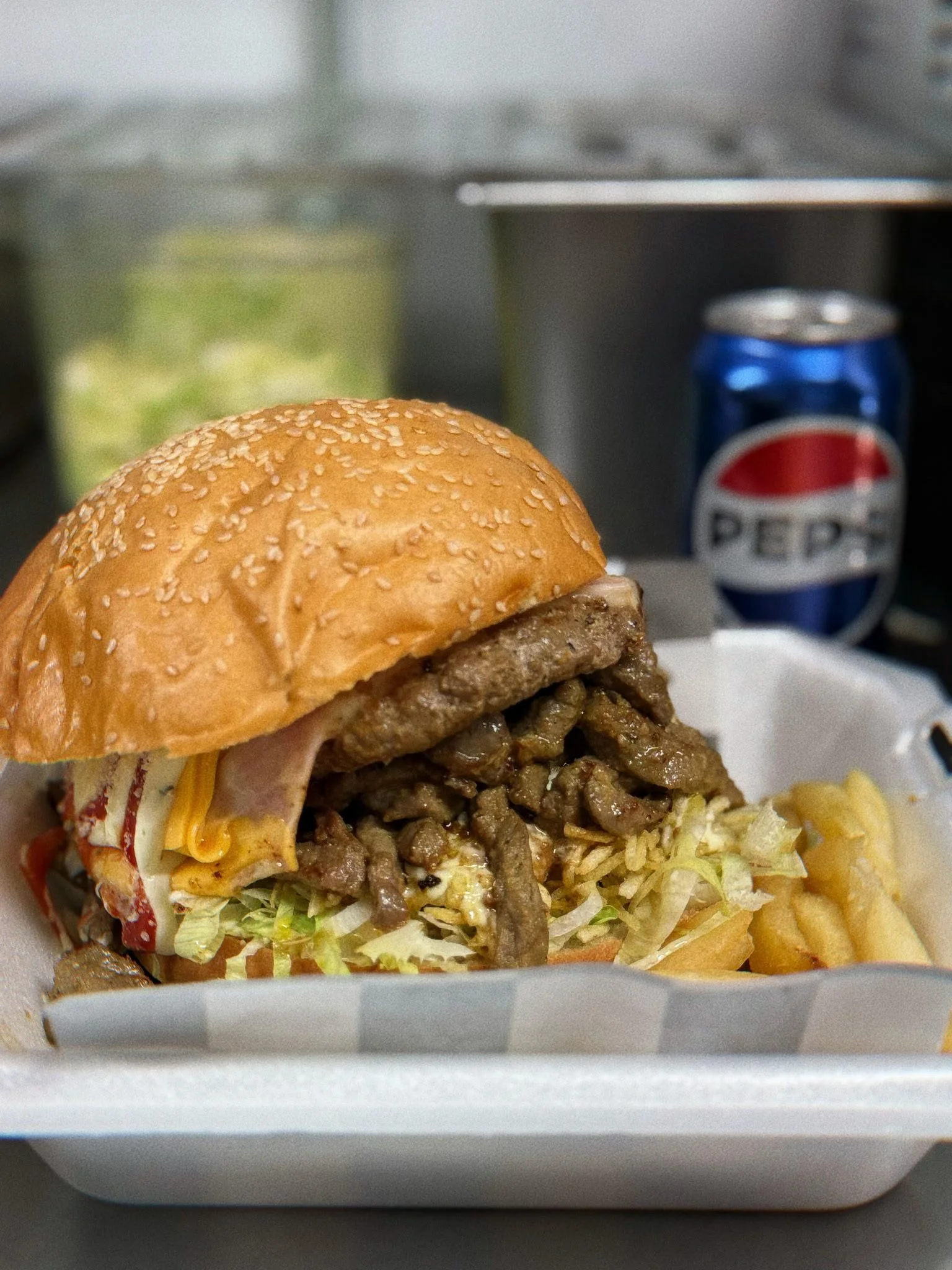 Hearty Mexican torta with grilled beef and fresh toppings