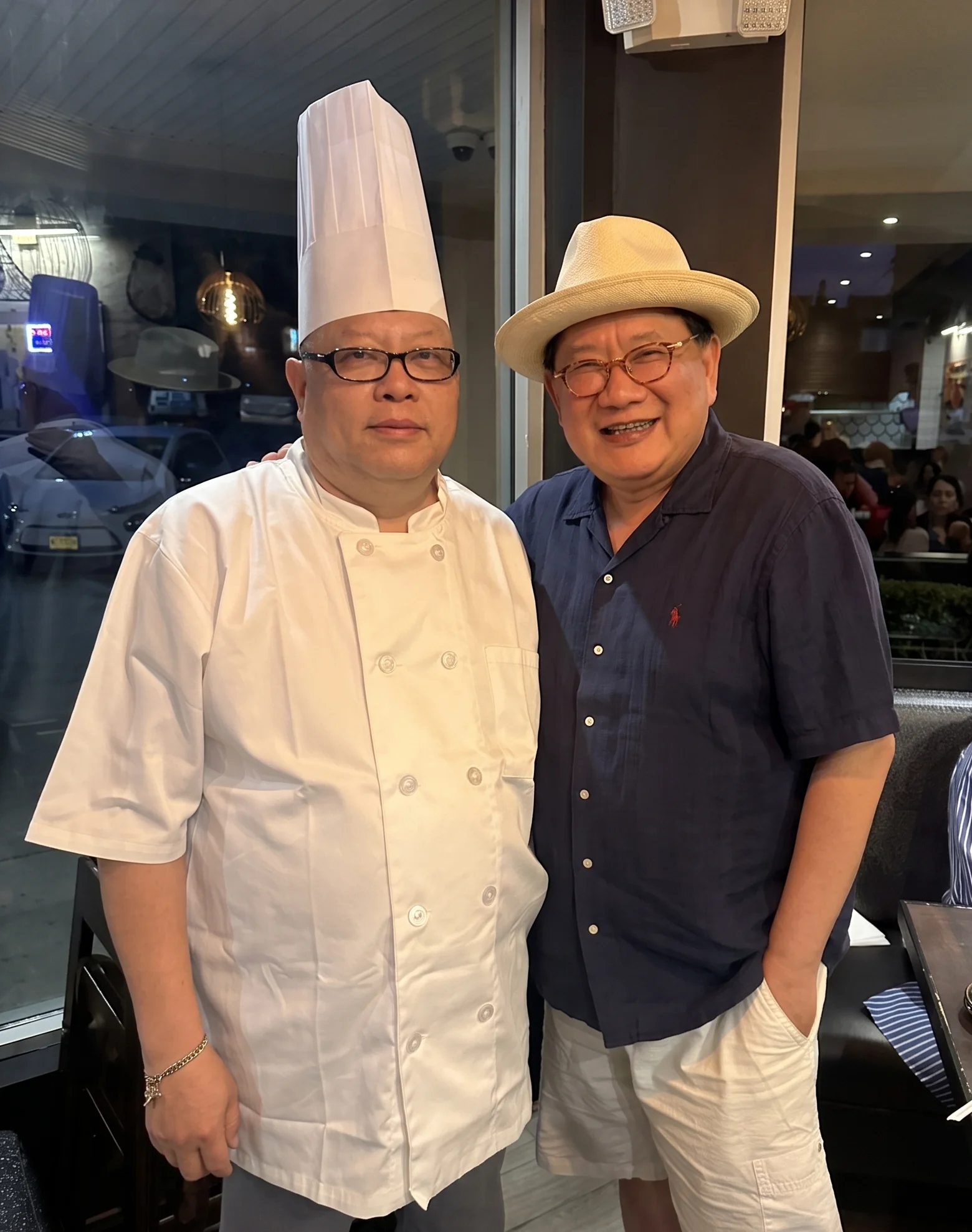 Chefs posing together in a vibrant restaurant setting