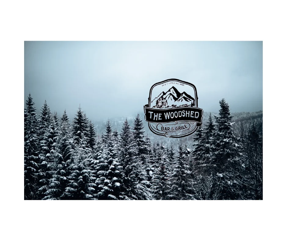 Snowy forest landscape with The Woodshed Bar & Grill logo