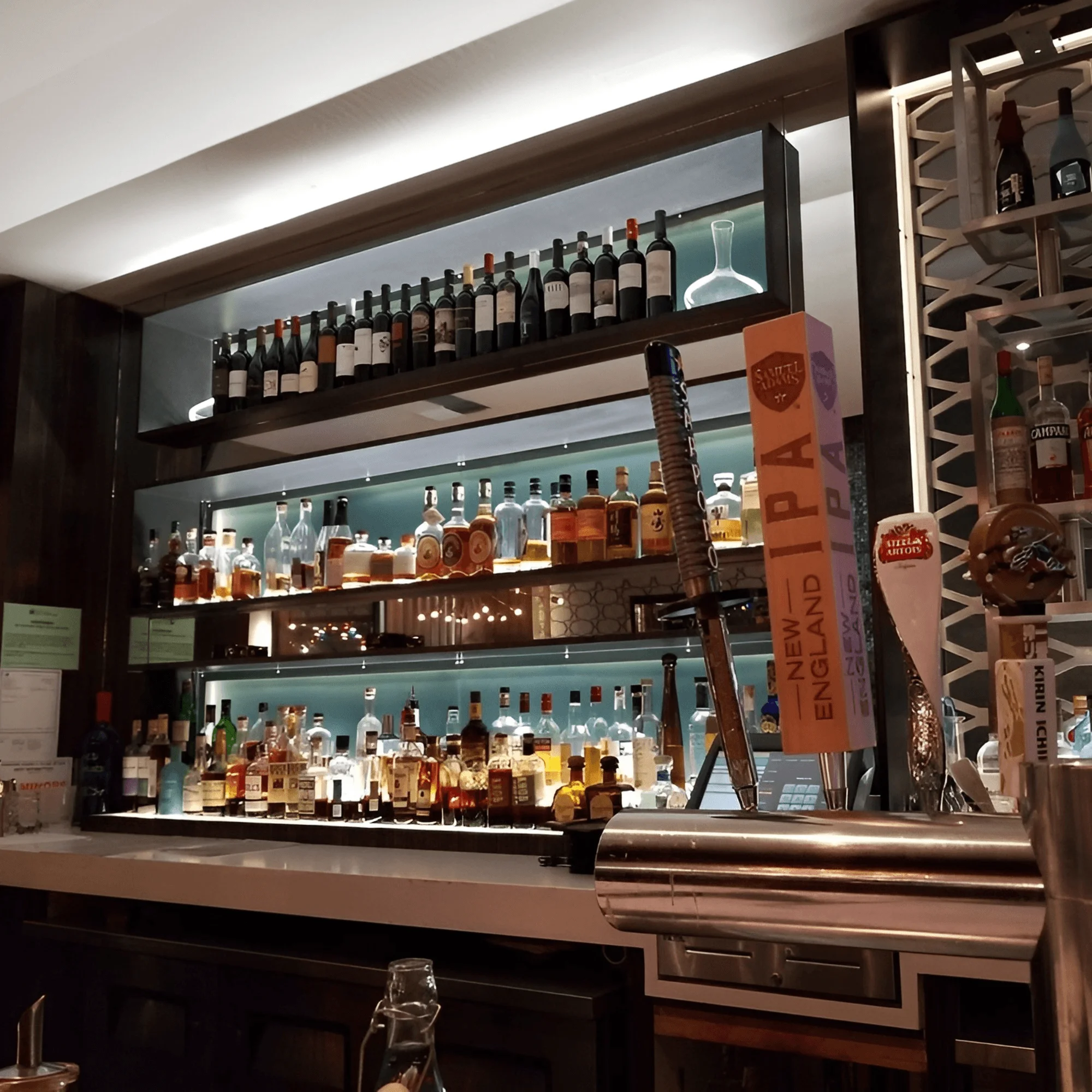 Well-stocked bar with various spirits and craft beer taps