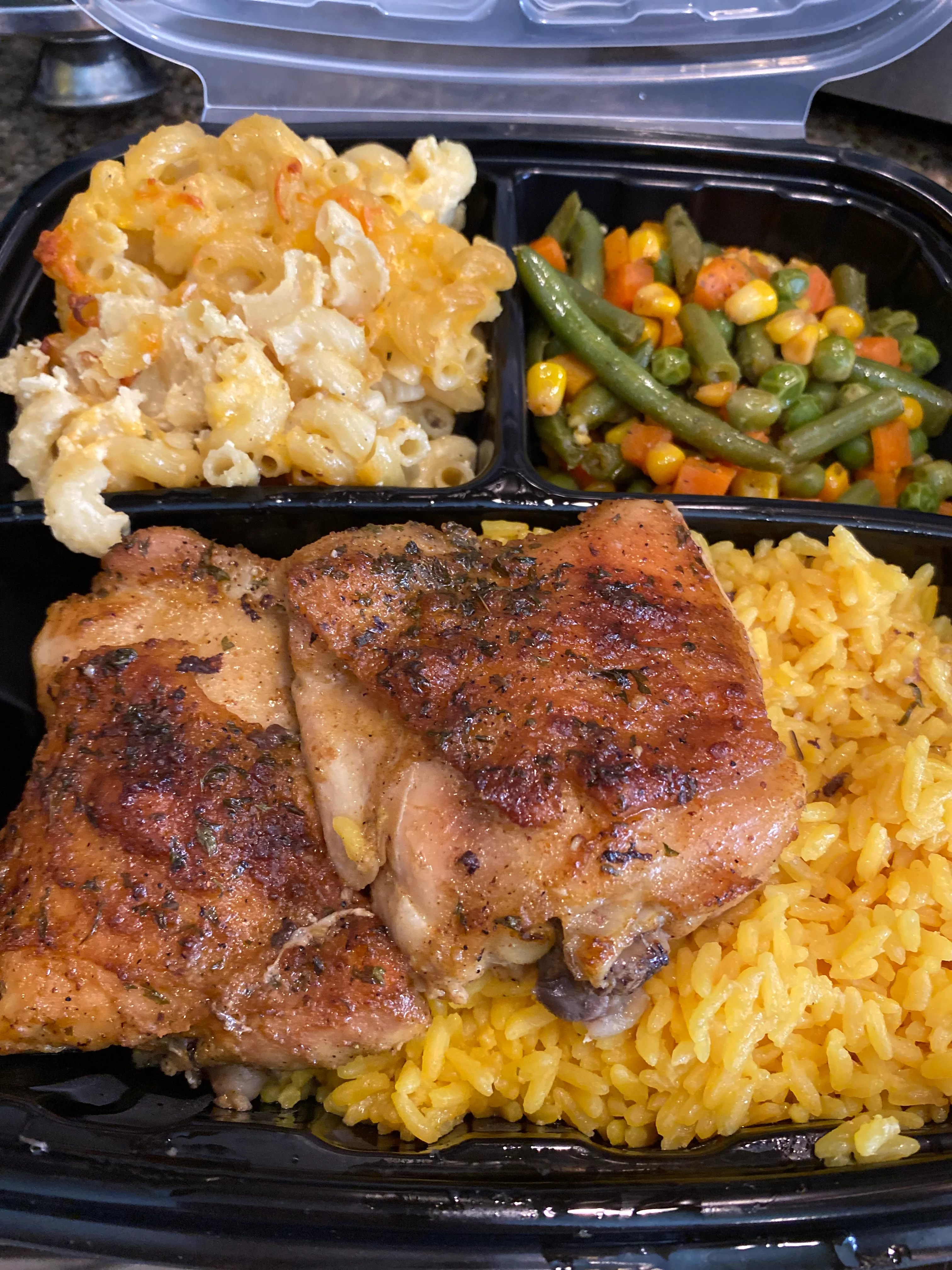 Southern-style chicken with yellow rice and sides