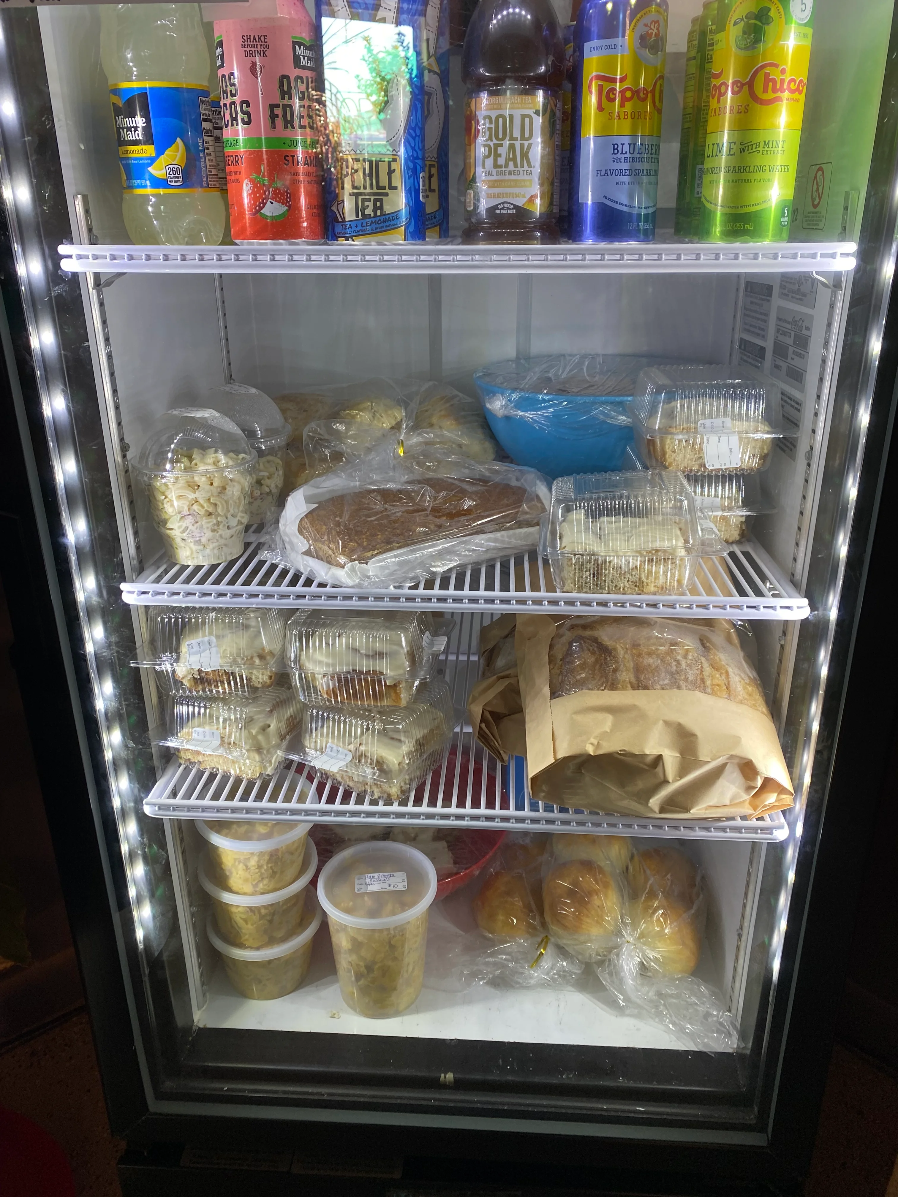 Chilled desserts and snacks in a restaurant fridge