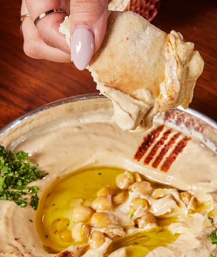 Delicious shawarma platter with fresh vegetables and sauces