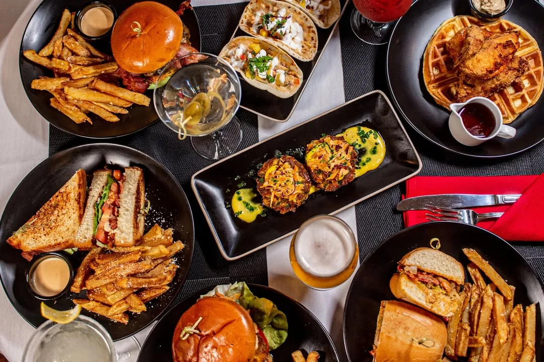 Assorted American comfort food platter with burgers and tacos
