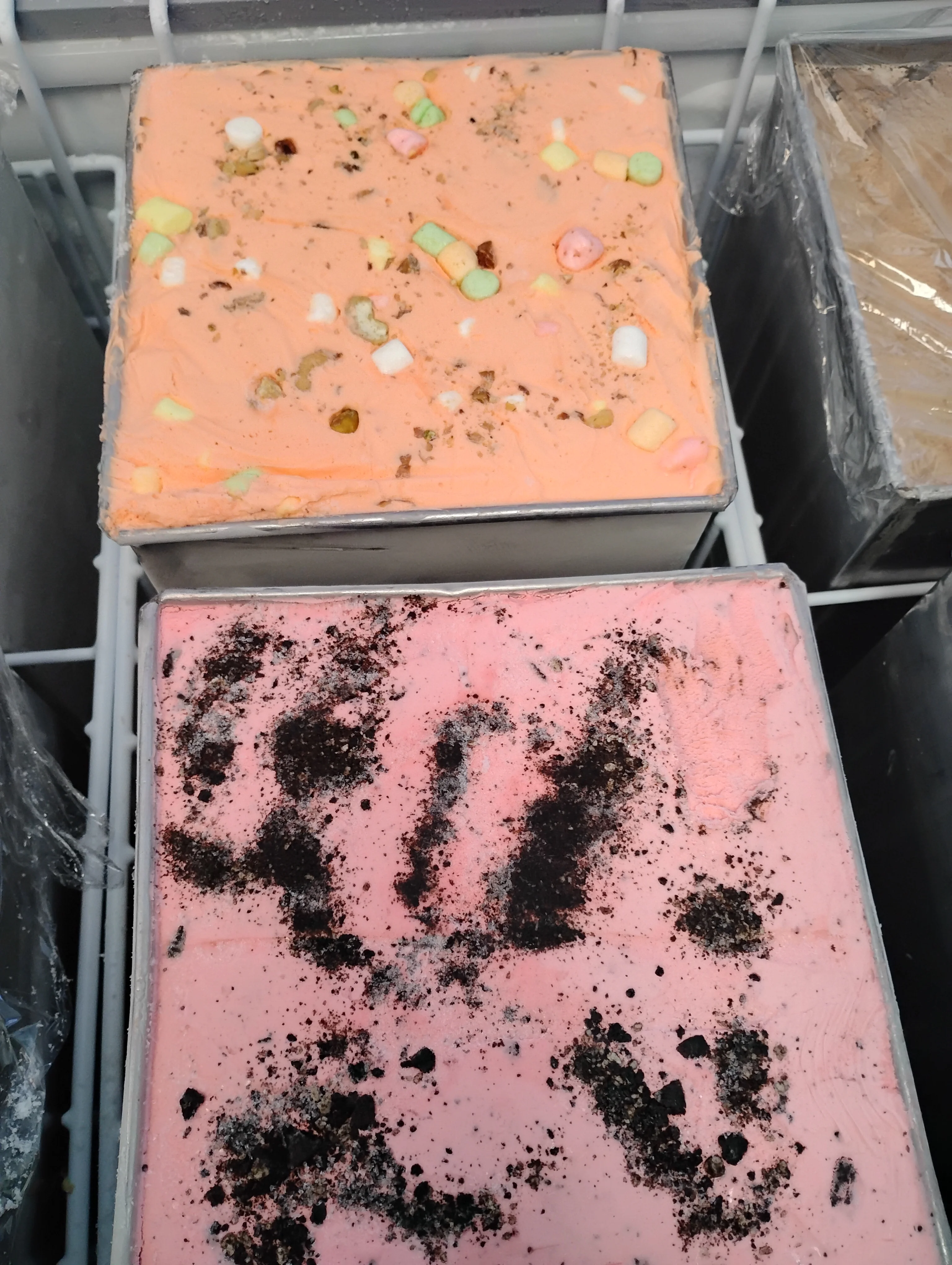Colorful ice cream tubs with unique toppings