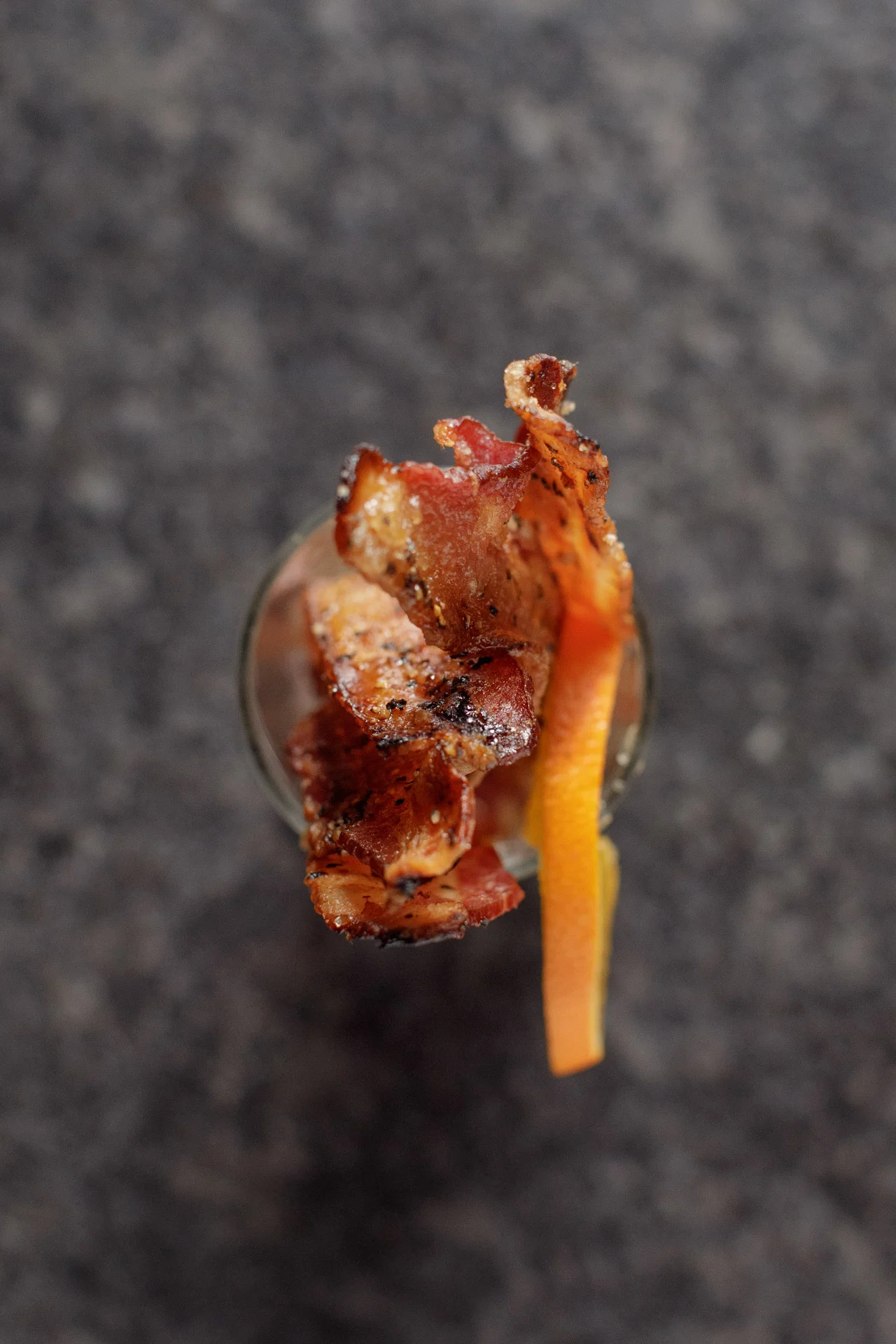 Bacon garnish on a cocktail glass