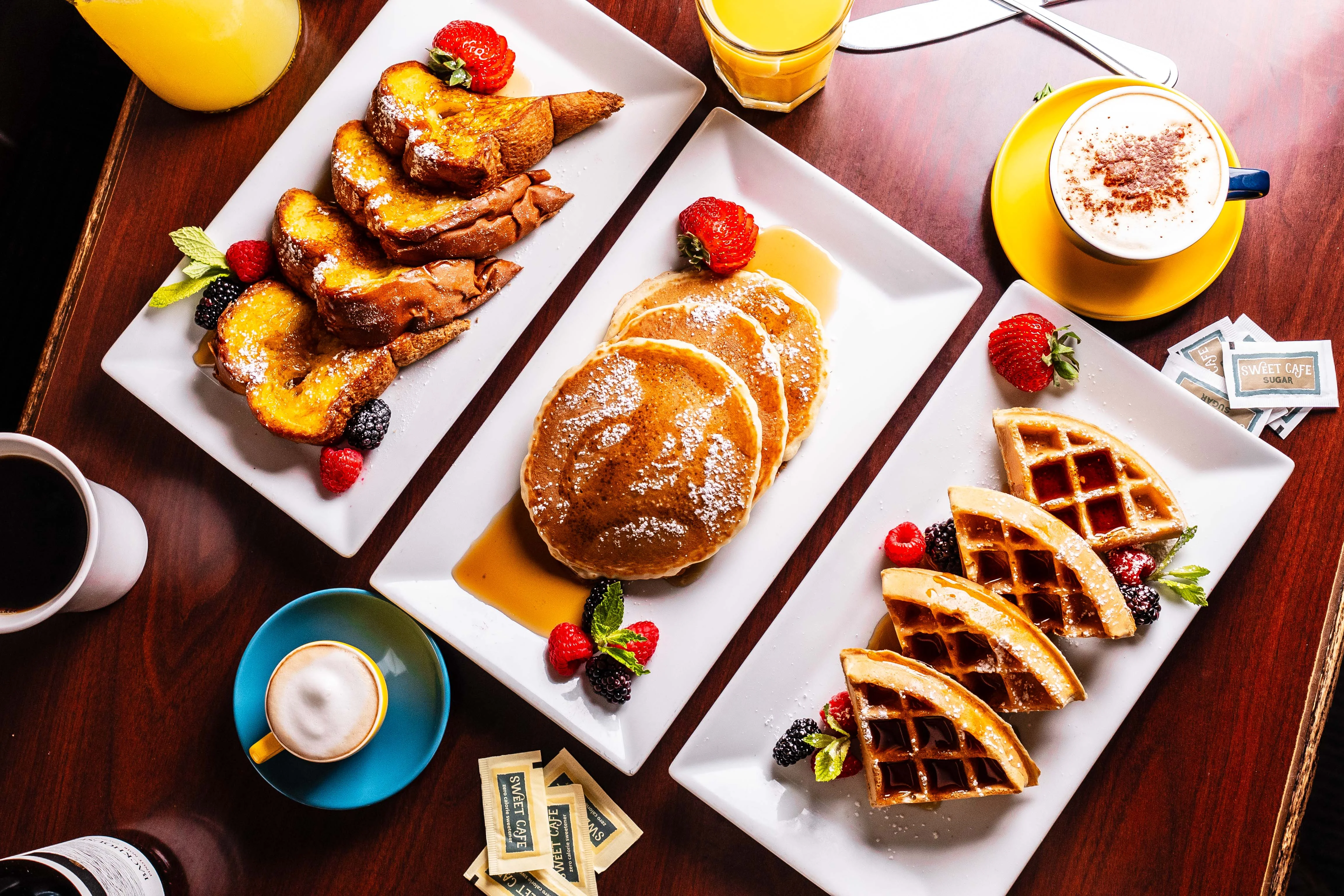 Delicious brunch spread featuring pancakes and fresh fruit salad
