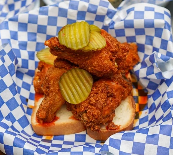 Spicy Southern fried chicken with pickles on toast