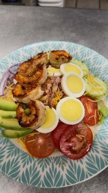 Grilled shrimp salad with avocado and hard-boiled eggs