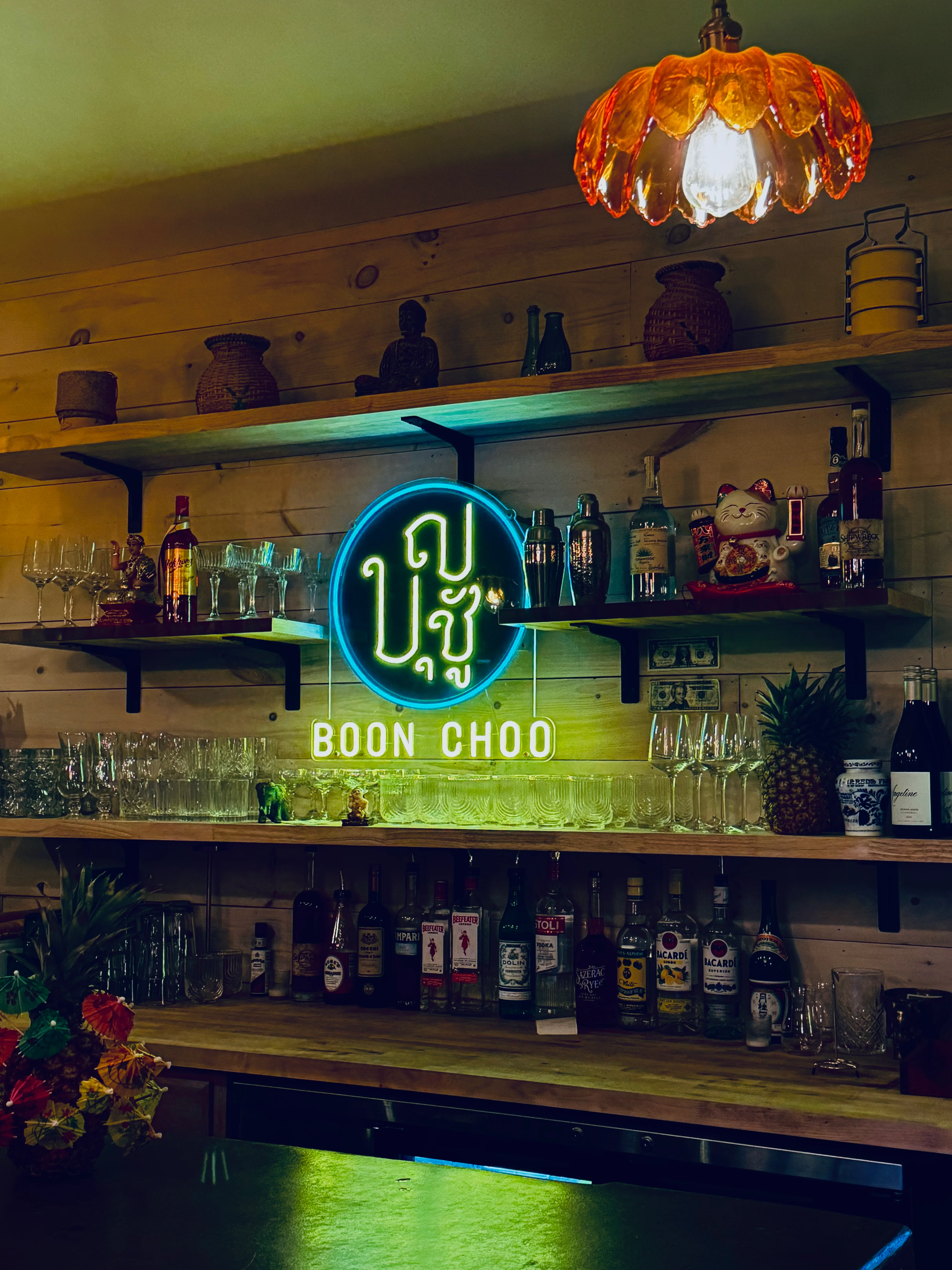 Cozy bar interior with neon sign and colorful decor