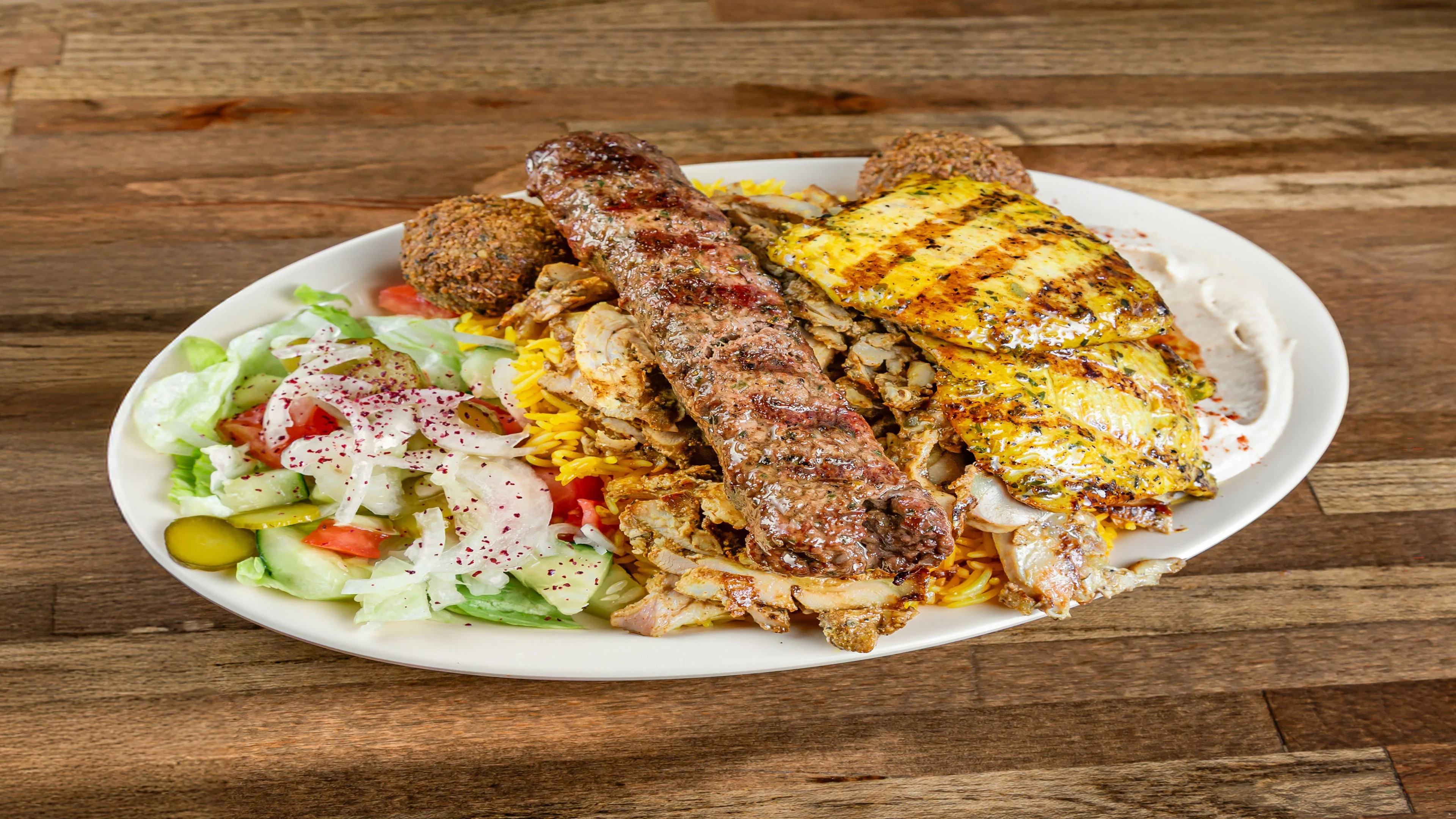 Pita Zone beef kefta kababs with rice and sides