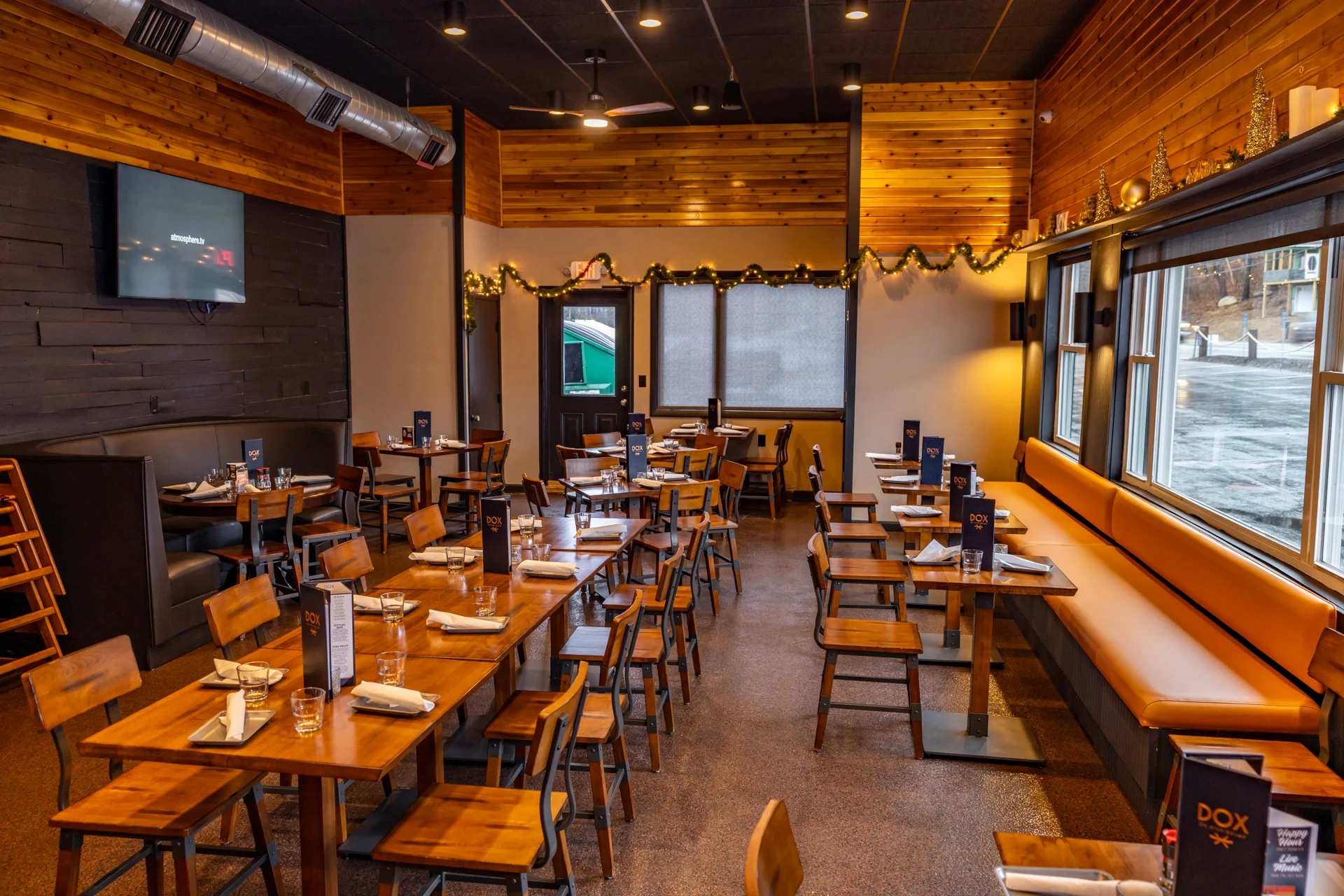 Cozy restaurant interior with wooden decor and seating
