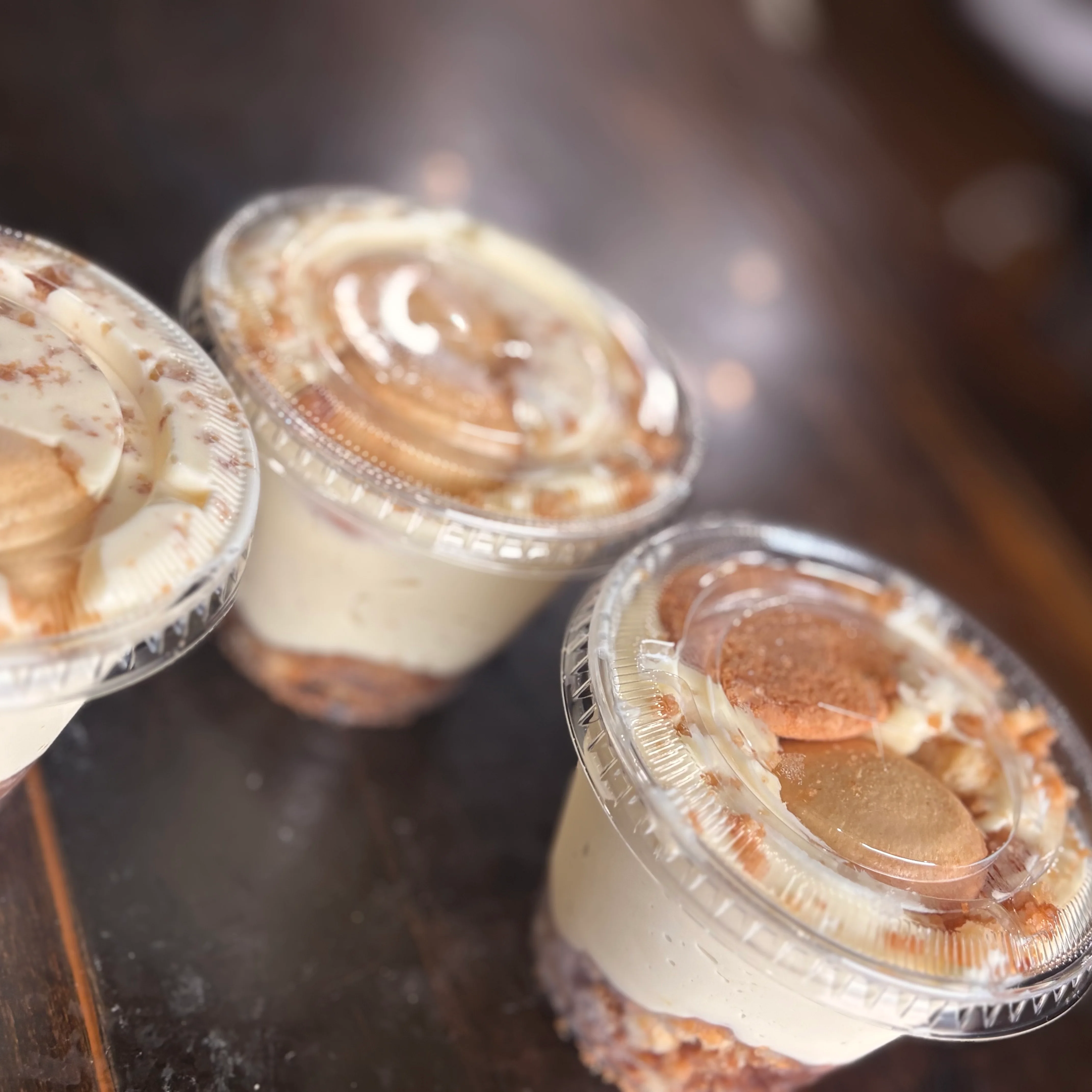 Delicious banana pudding cups with whipped cream and cookies
