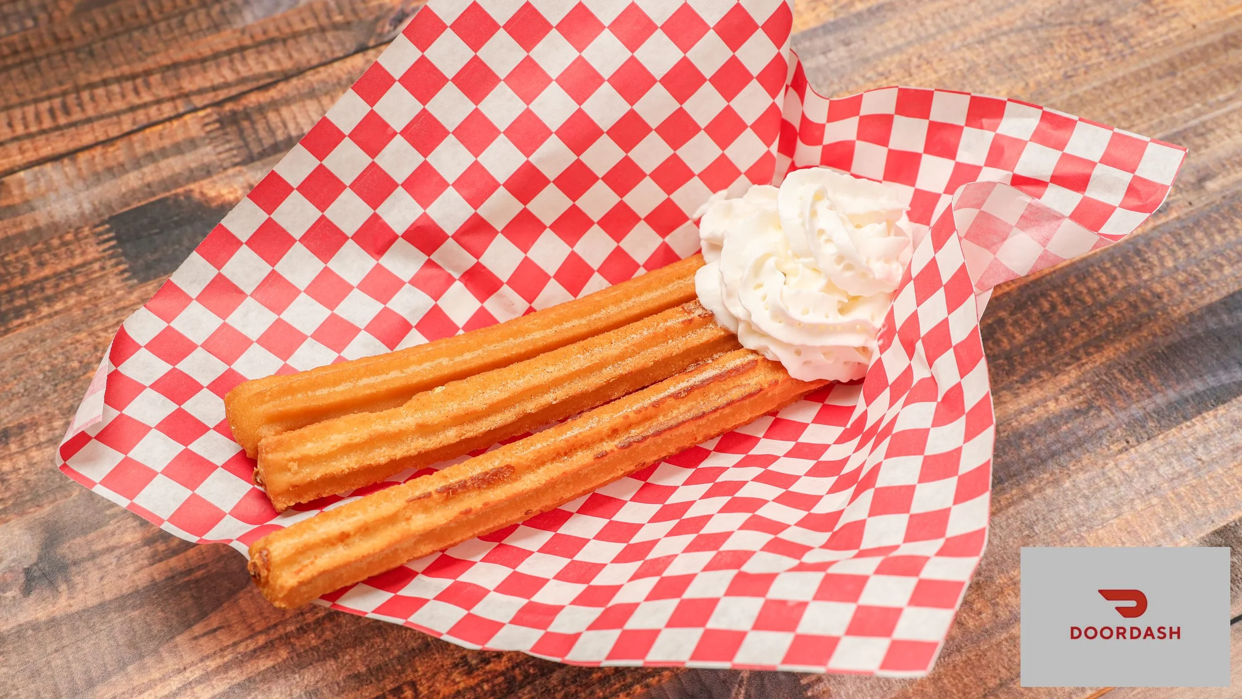 Delicious churros served with whipped cream