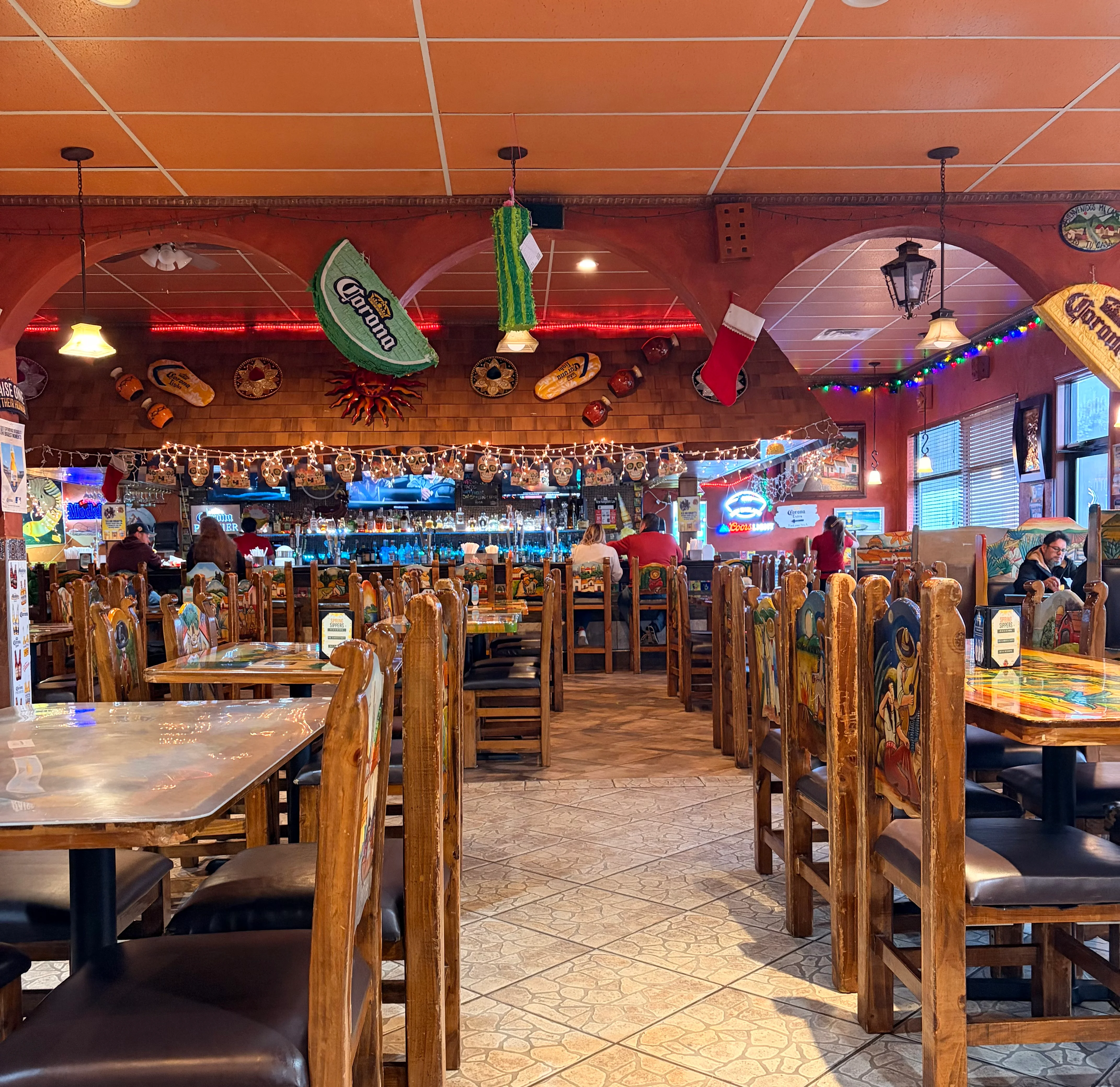 Delicious gourmet burger with fresh toppings on a wooden table.