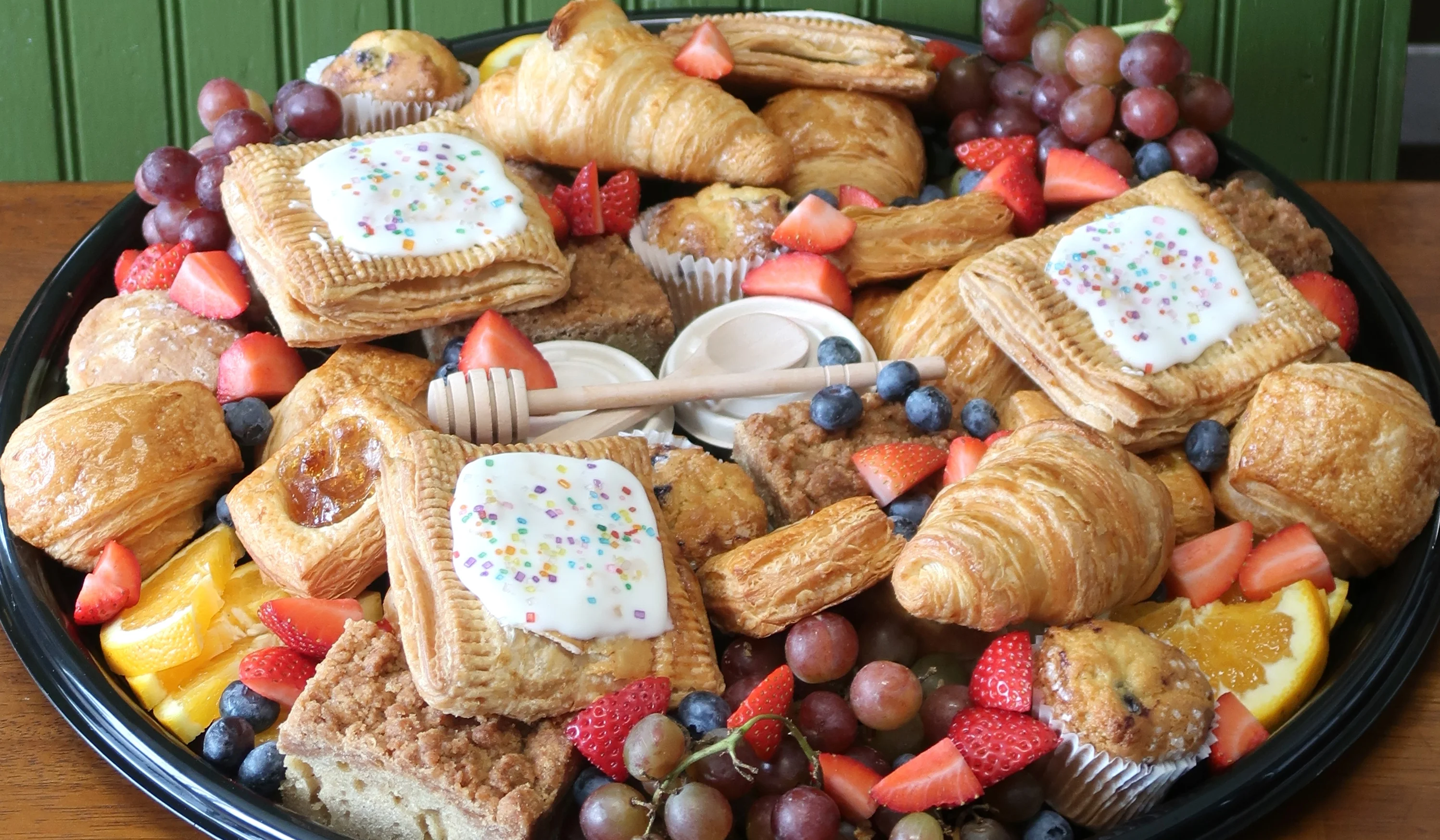 Assorted French pastries on a wooden platter