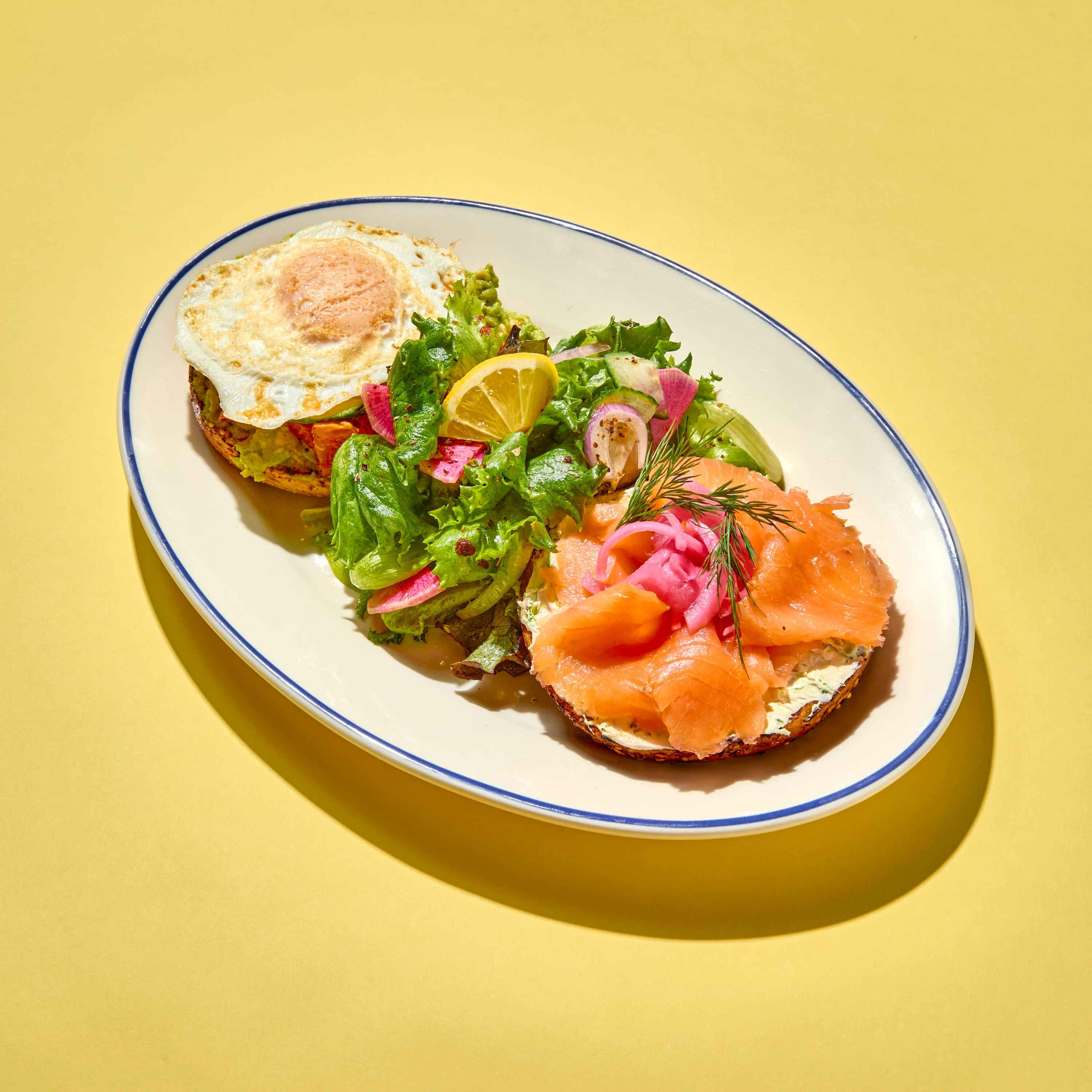 Open-faced smoked salmon sandwich with salad, a Nordic-inspired dish
