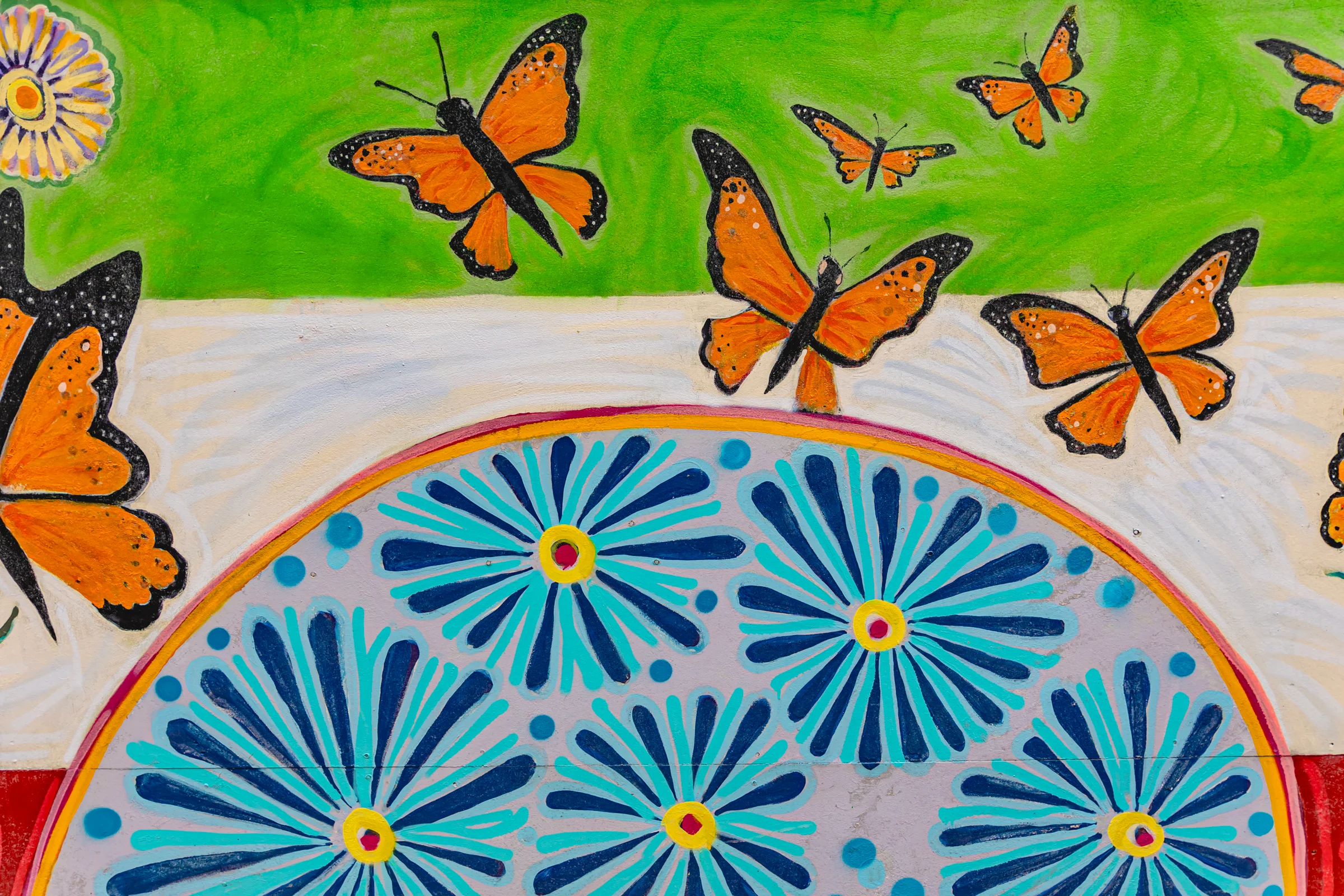 A painting featuring butterflies and flowers