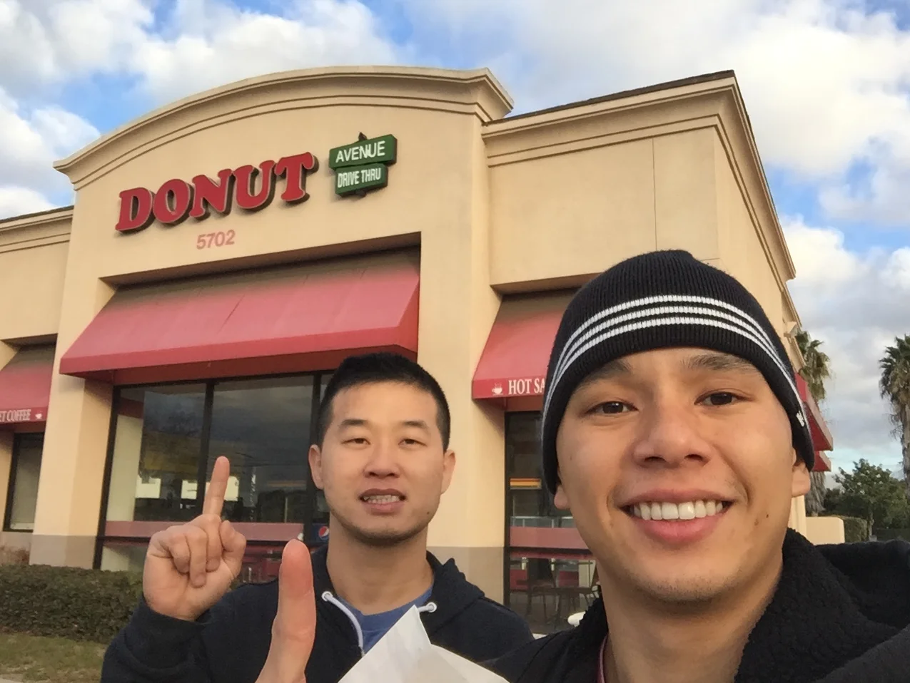 Founders Danny Truong and Kim Tang  of Painted Dough standing outside their Chino, California storefront.