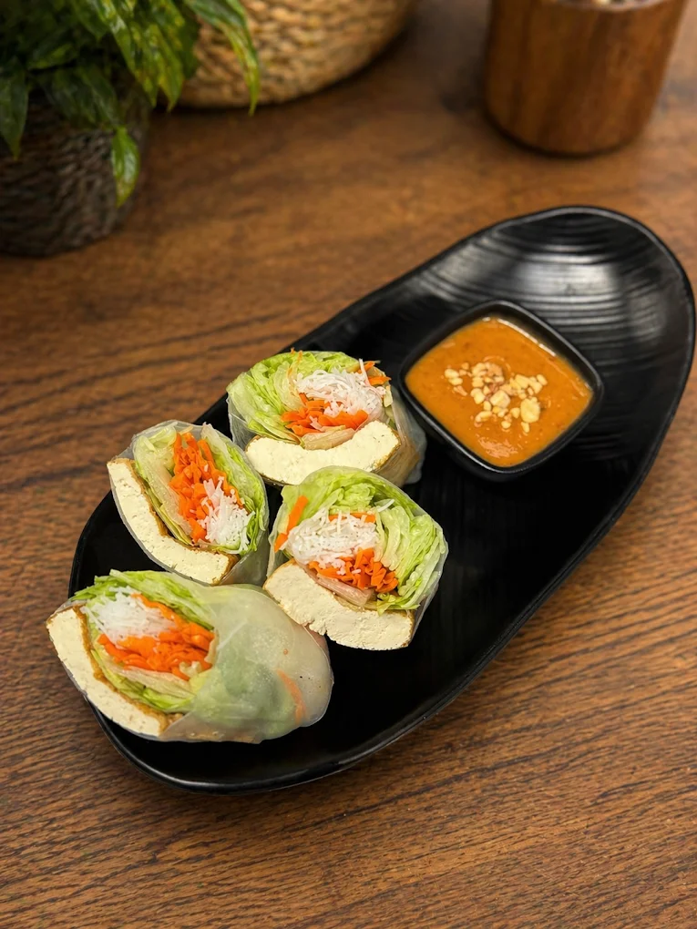 Vietnamese shrimp spring rolls on a white plate