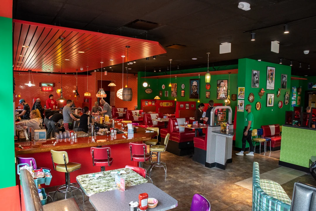 Vibrant restaurant interior with colorful decor and busy dining area