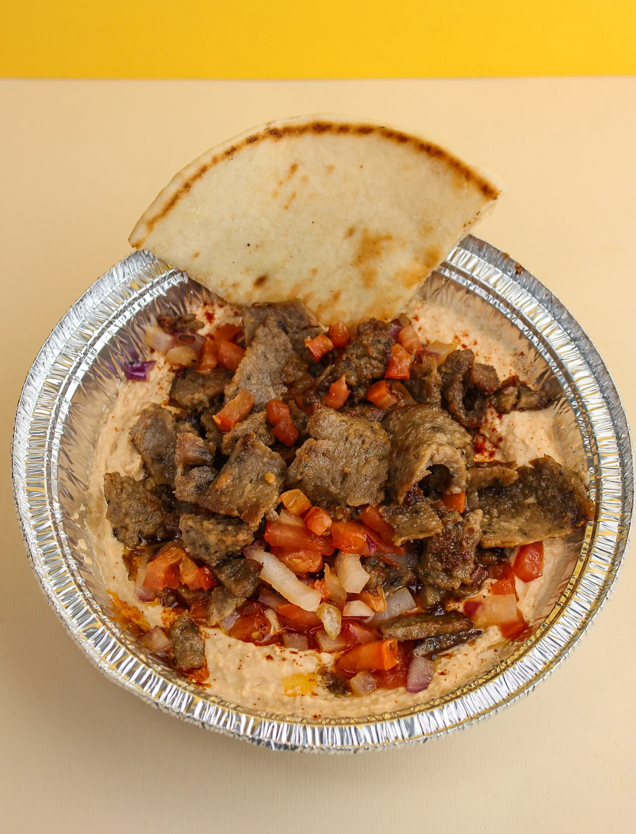 A bowl of mediterranean food
