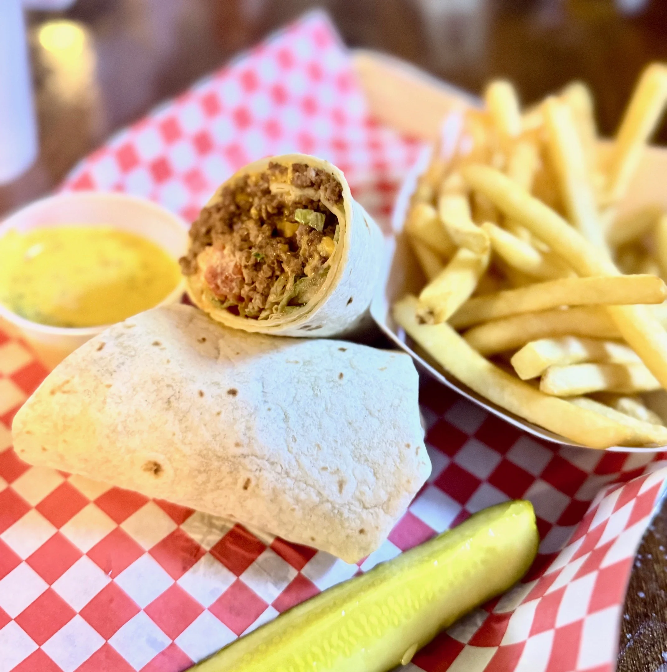 Delicious burrito with fries and dipping sauce