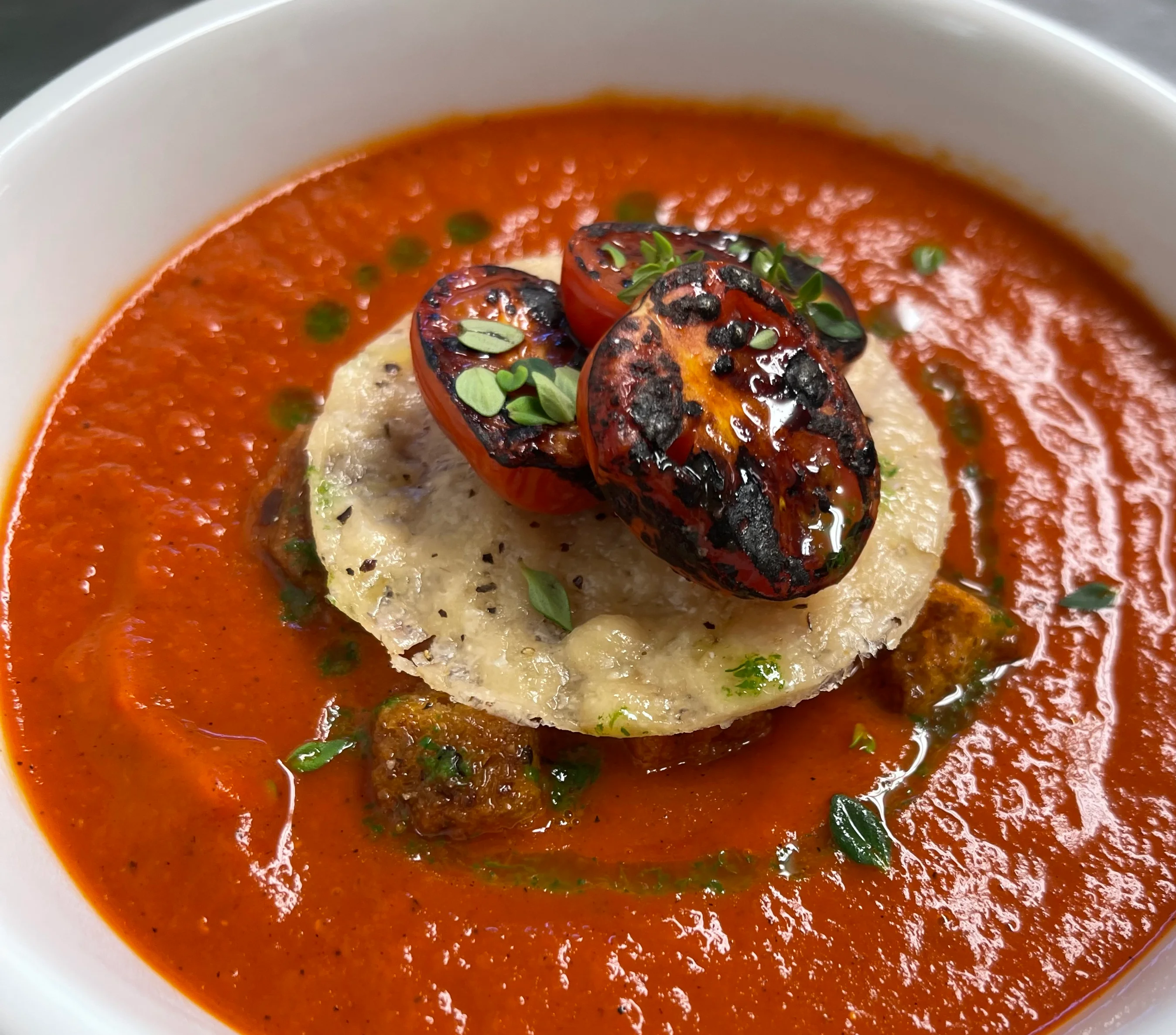 tomato soup, parmesan crisp, blistered tomatoes