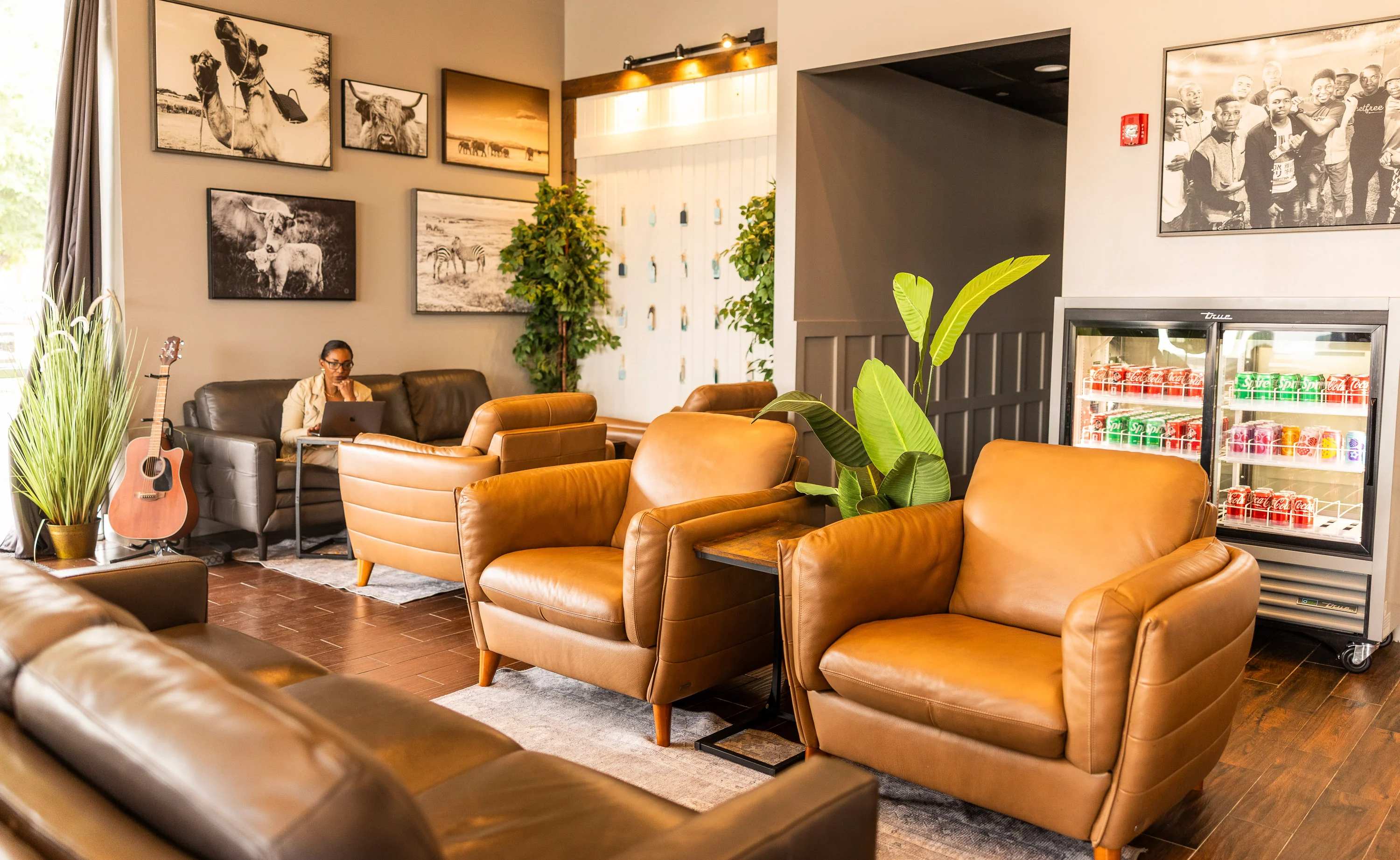 Cozy restaurant lounge with leather seating and artwork