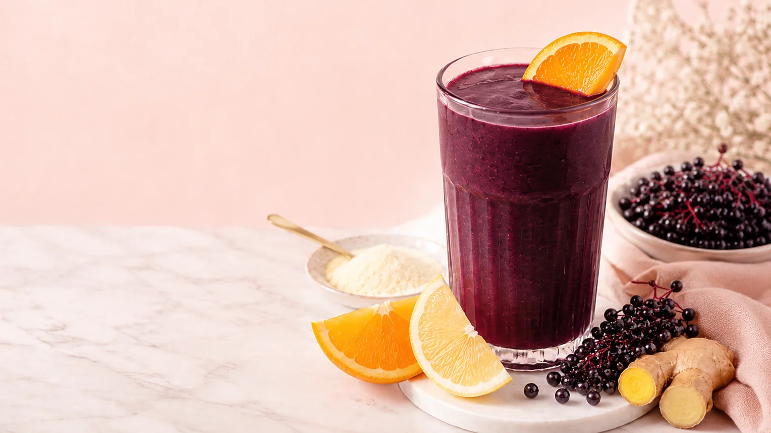 Refreshing orange smoothie in a glass with citrus fruits