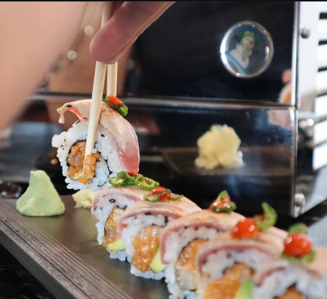 Artfully arranged sushi rolls with fresh toppings
