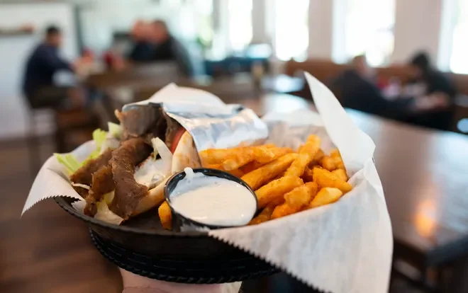 Delicious cheesesteak sandwich with crispy fries