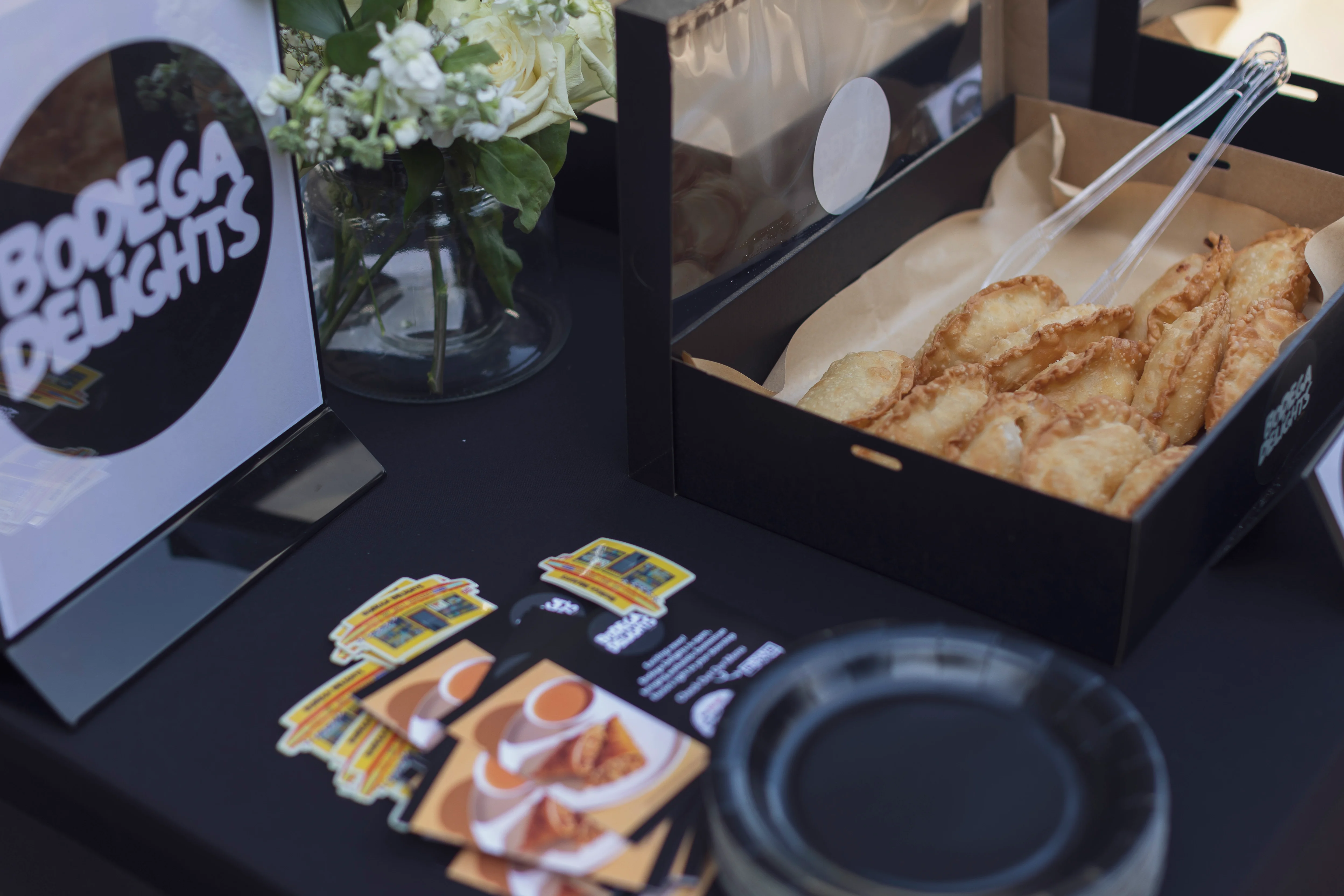 Crispy empanadas served in a stylish takeout box