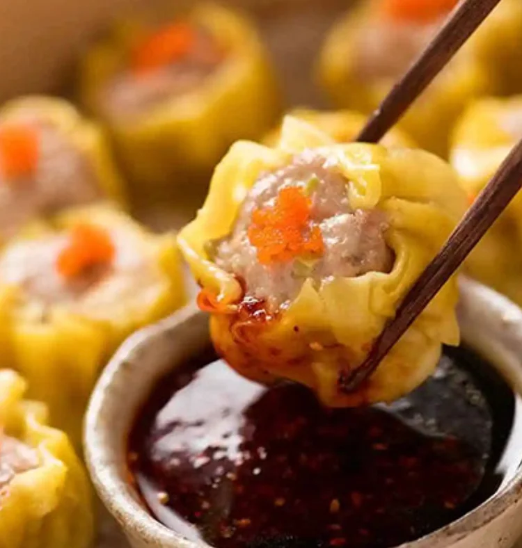 Delicious dim sum siu mai with dipping sauce