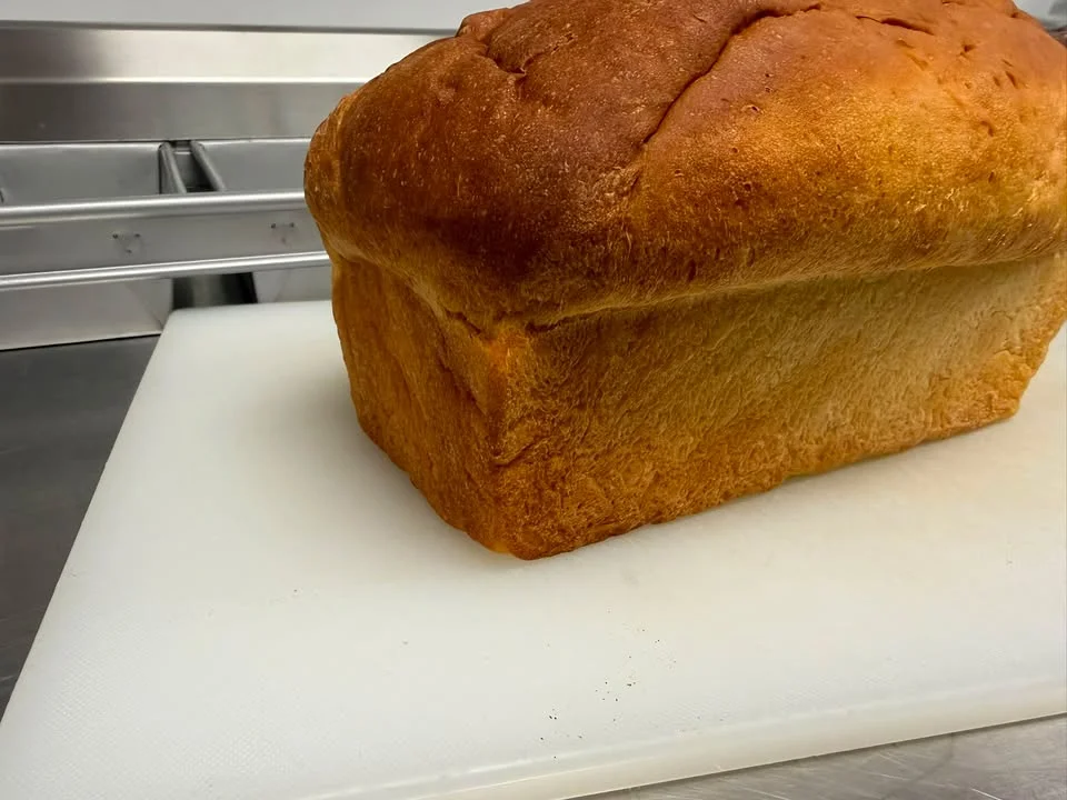 Freshly baked loaf of classic white bread