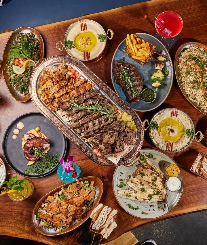 Delicious shawarma platter with fresh vegetables and sauces