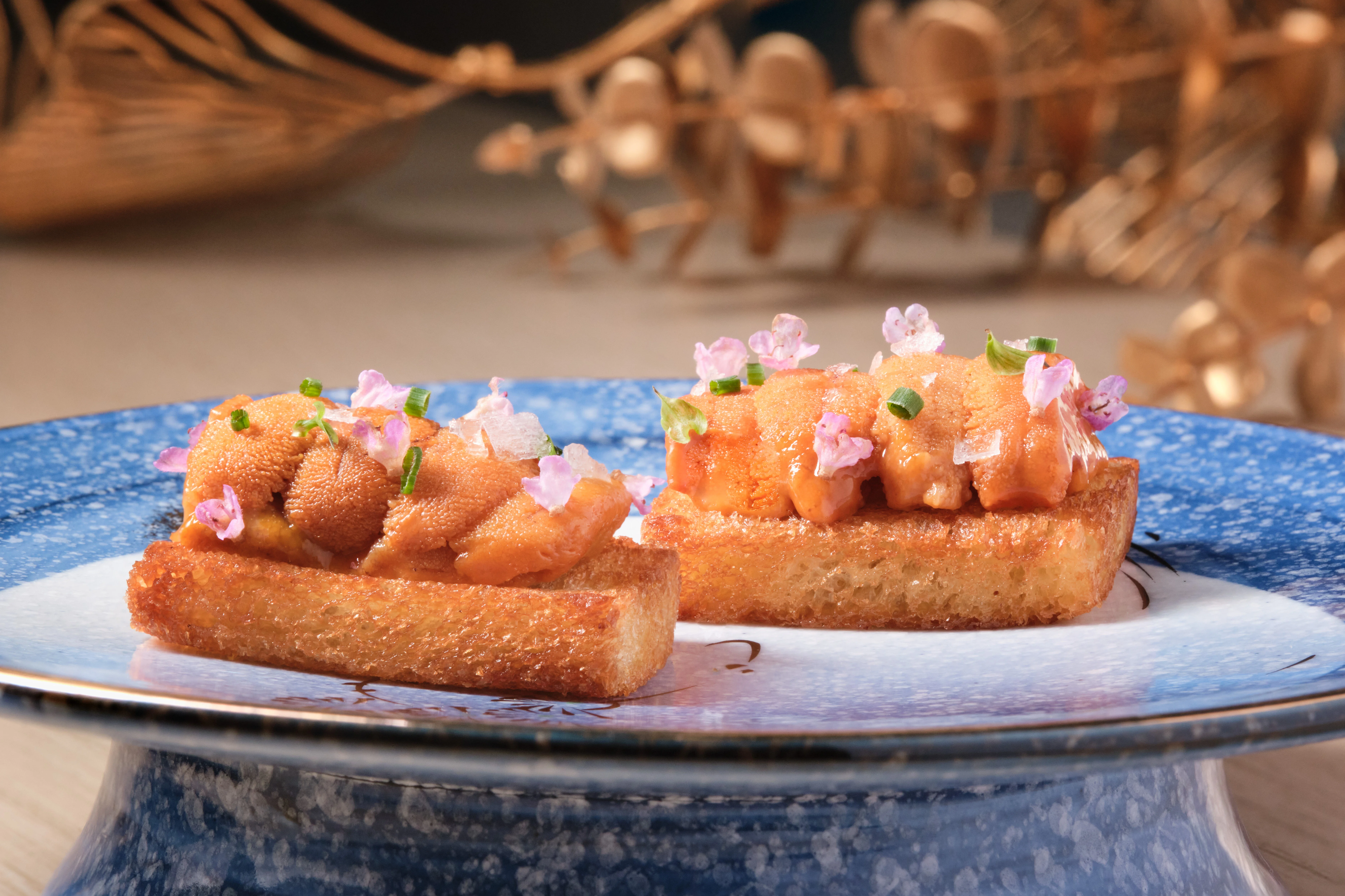 Japanese uni toast with crispy bread and edible flowers