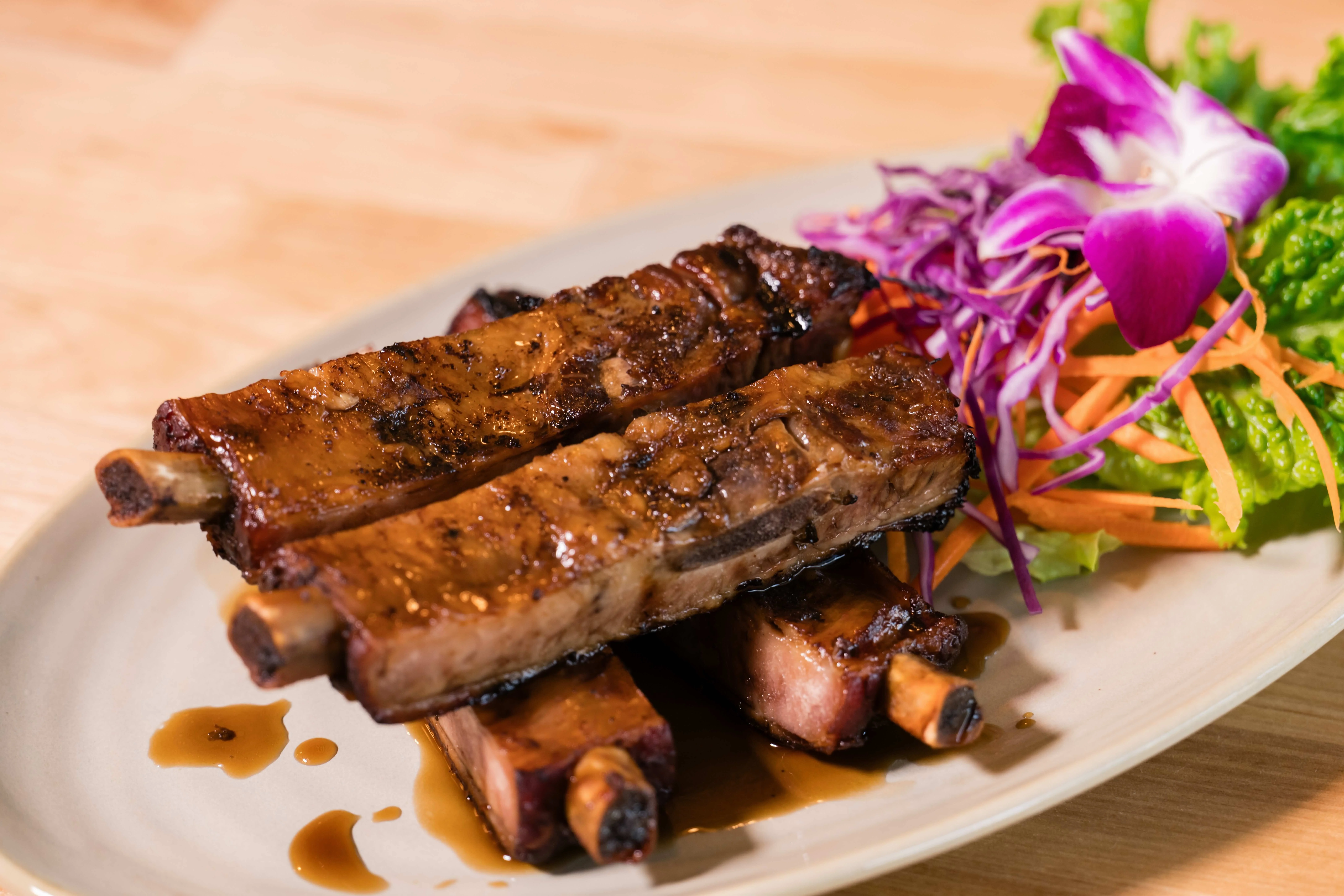 Grilled Korean BBQ short ribs with fresh salad