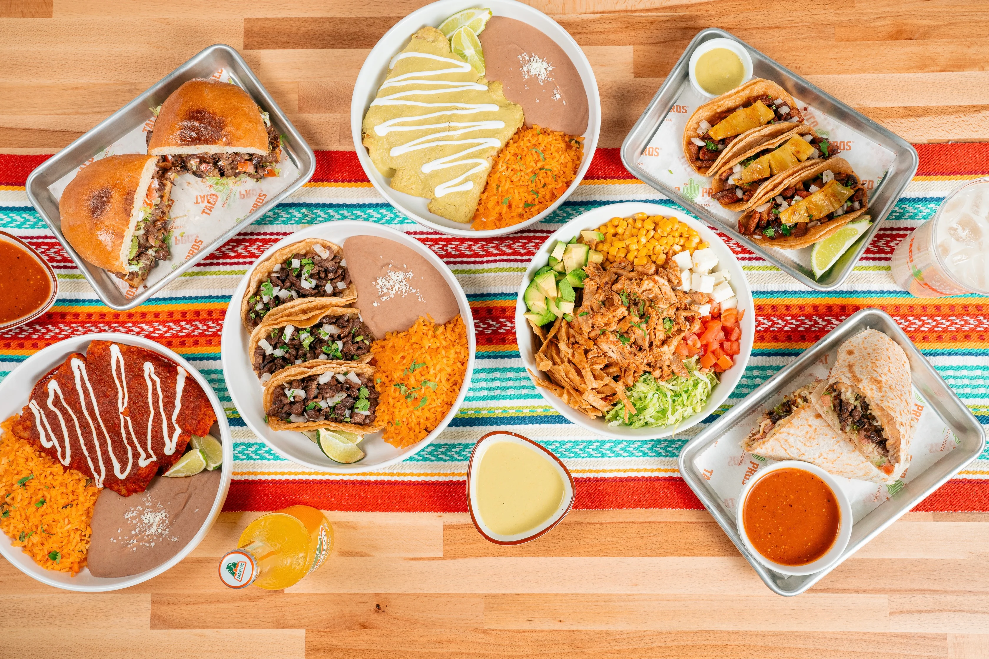 Colorful Mexican feast with tacos, enchiladas, and rice