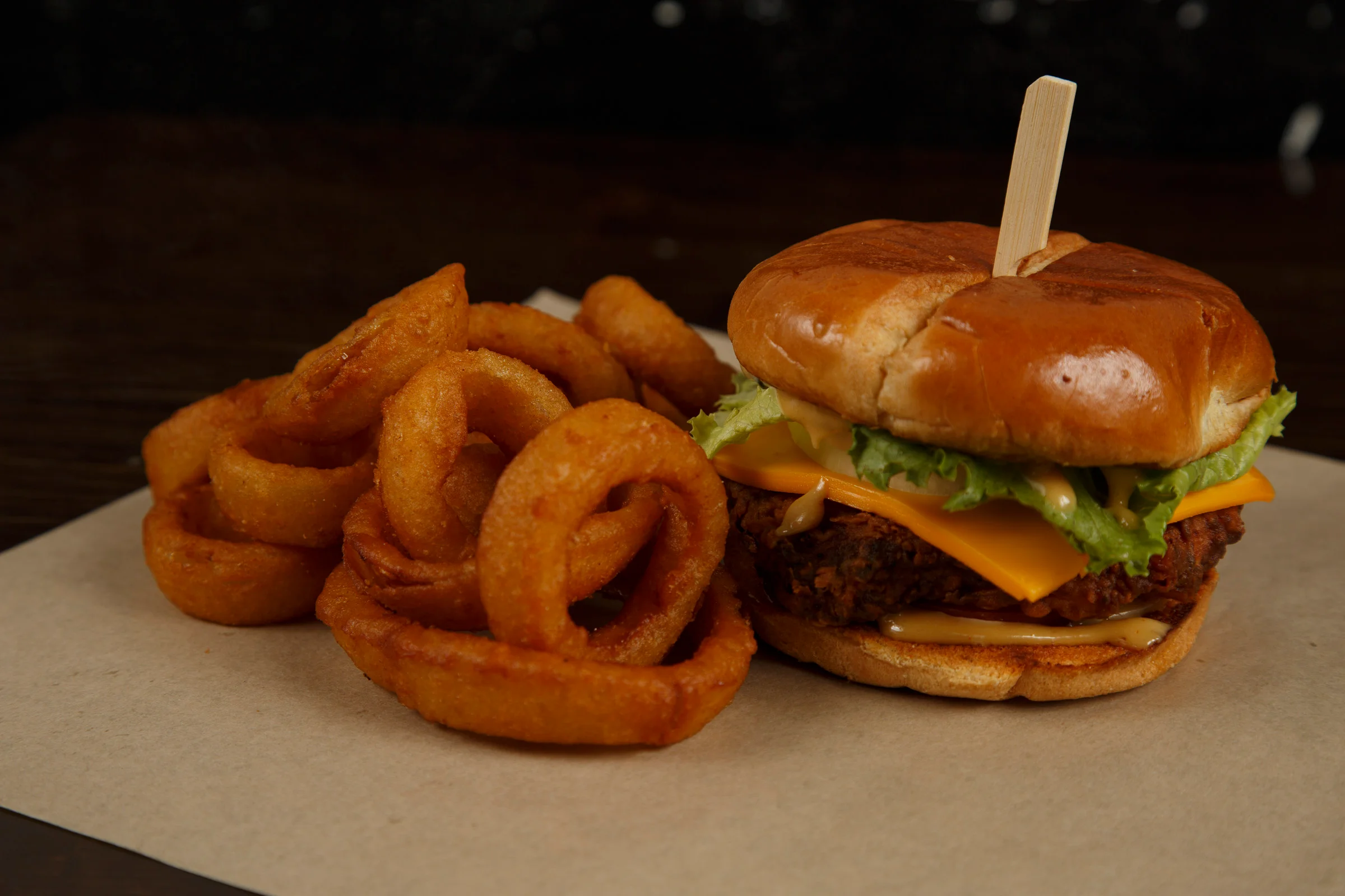 Crispy fried chicken sandwich with onion rings