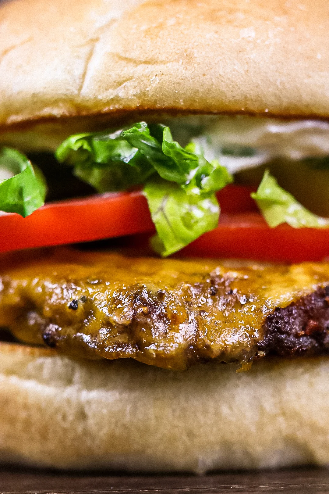 Juicy cheeseburger with fresh lettuce and tomato