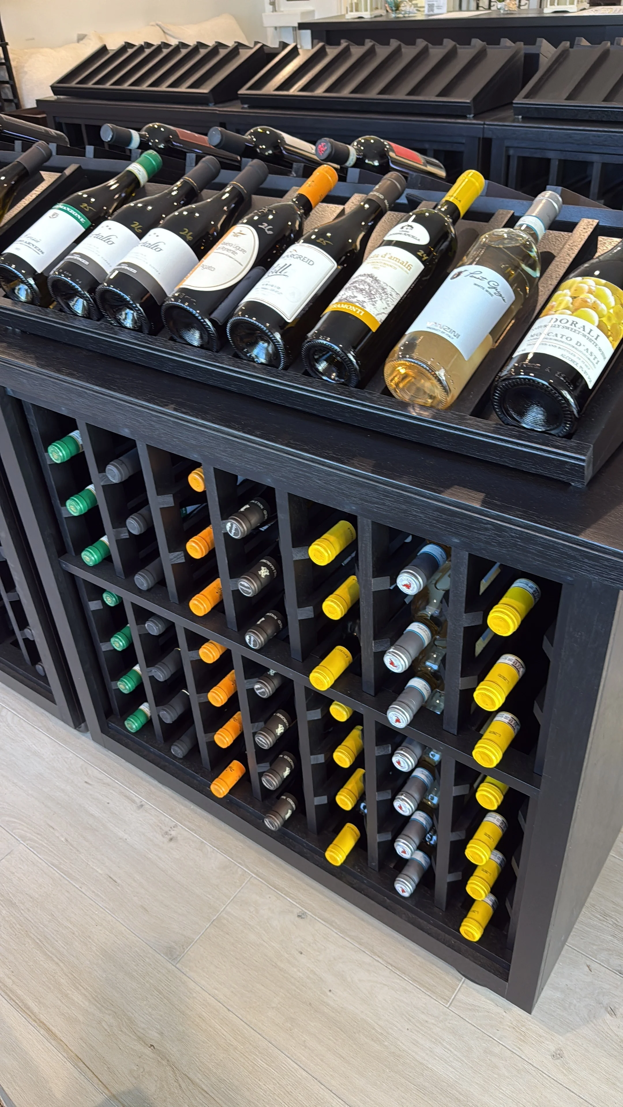 Wine bottles displayed in a modern wooden wine rack