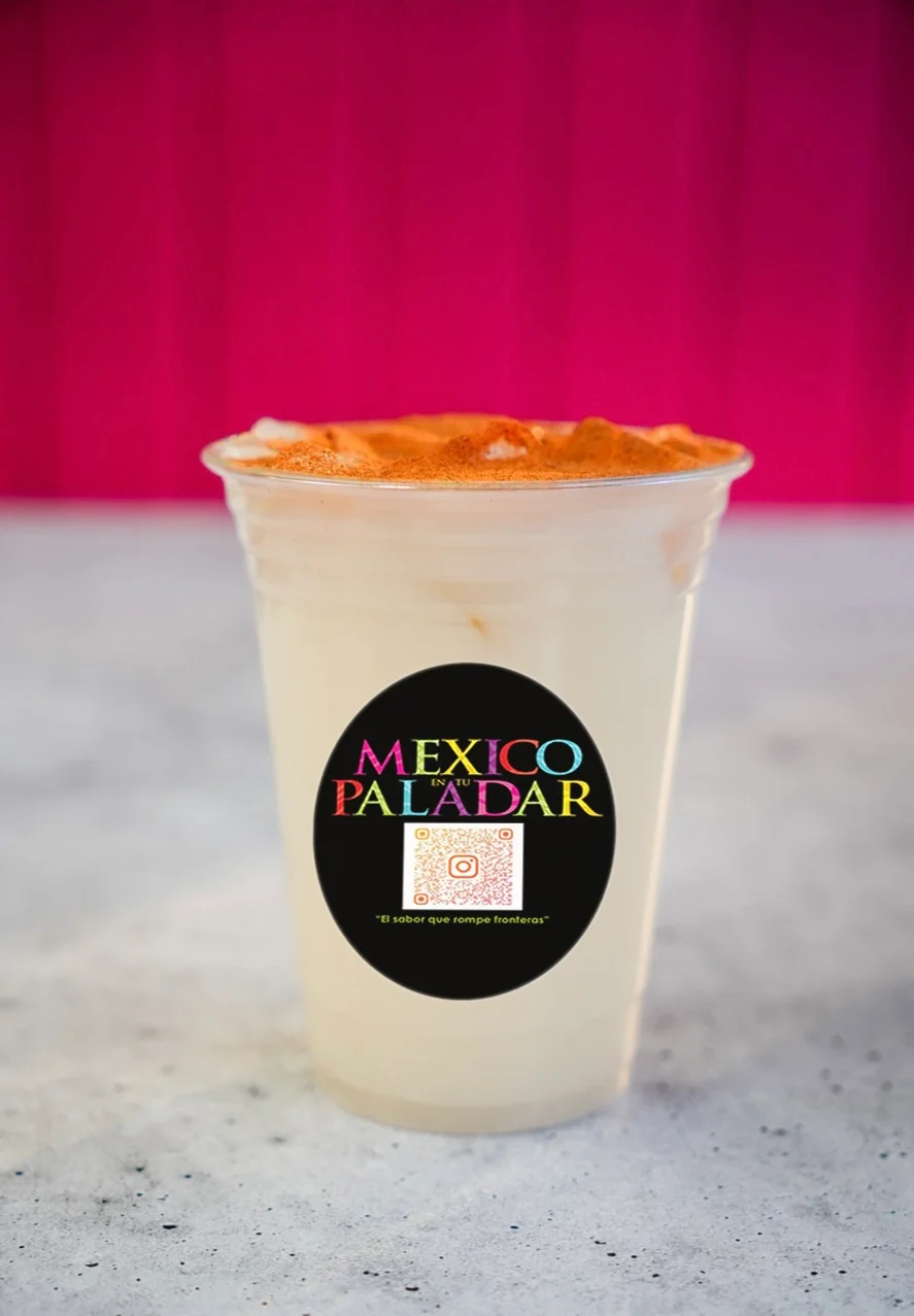 Refreshing Mexican horchata in a clear cup with cinnamon topping