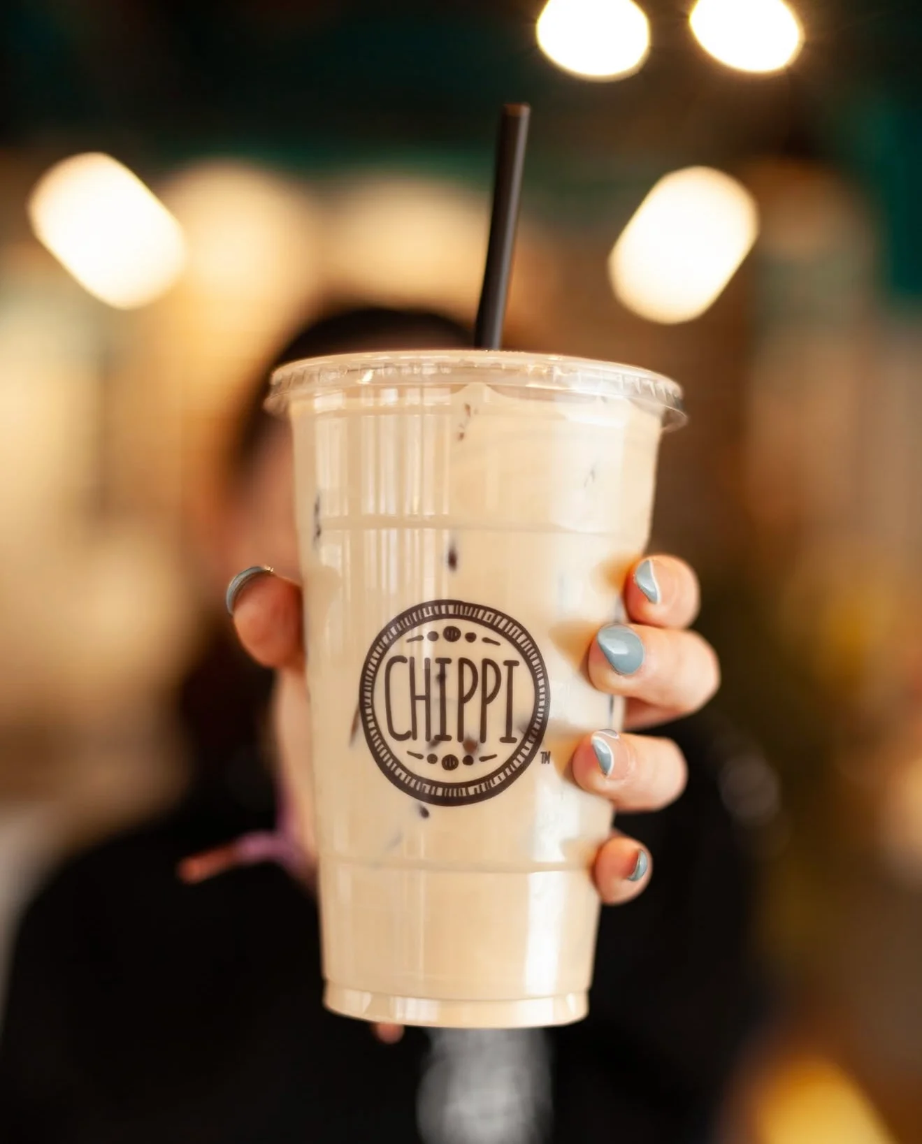 Close up of a hand holding a CHiPPi up to the camera.