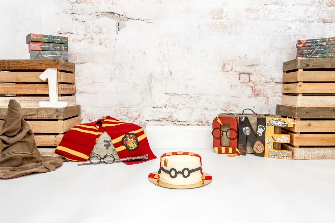 Themed birthday setup with Harry Potter cake and accessories