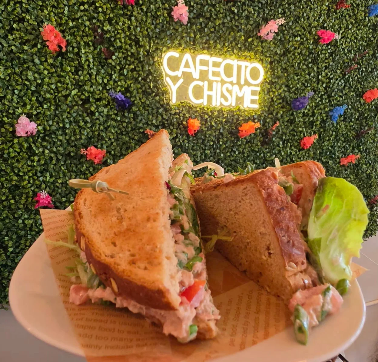 Delicious Cuban sandwich served on a plate in a vibrant café setting