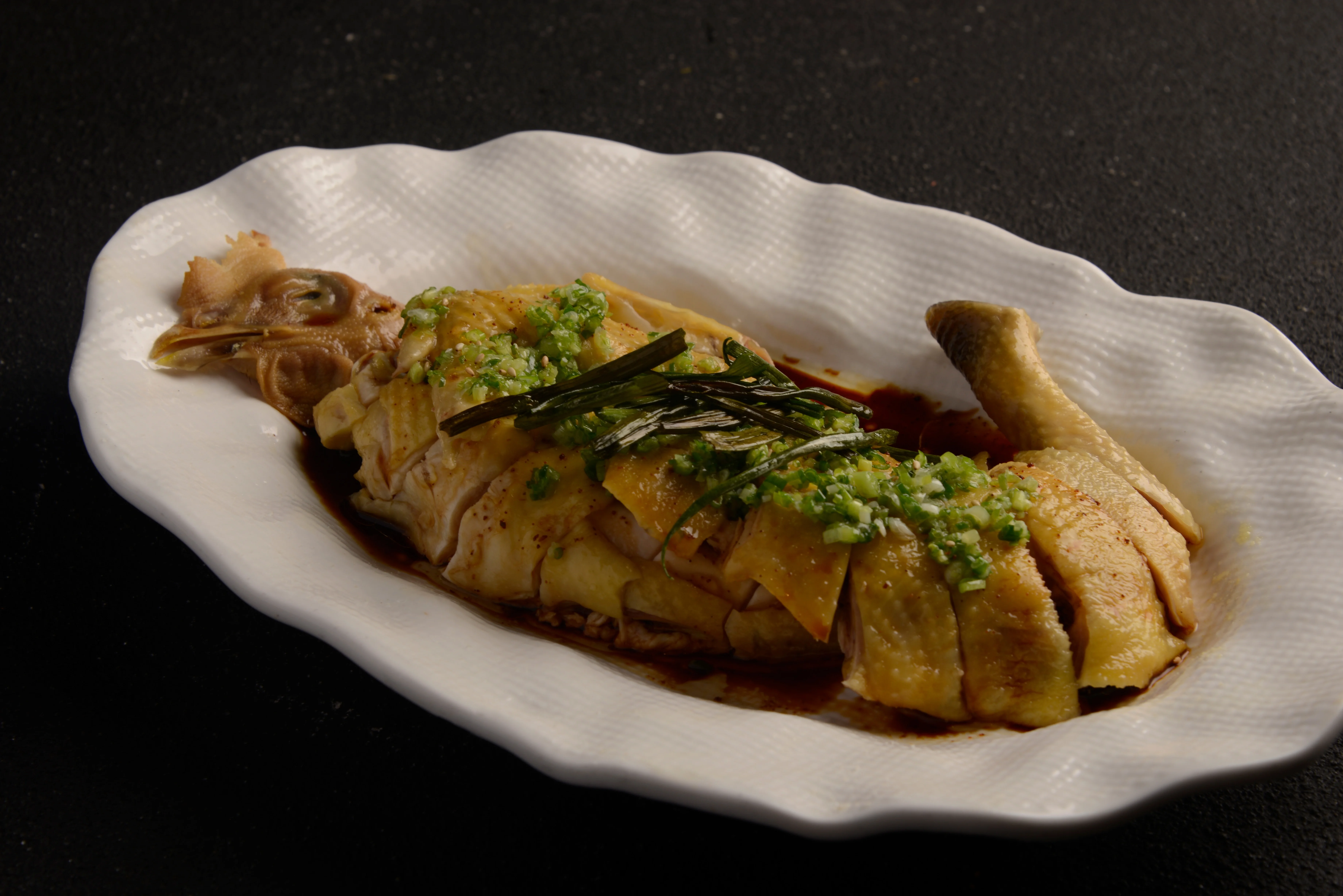 Chinese steamed chicken with scallions and soy sauce