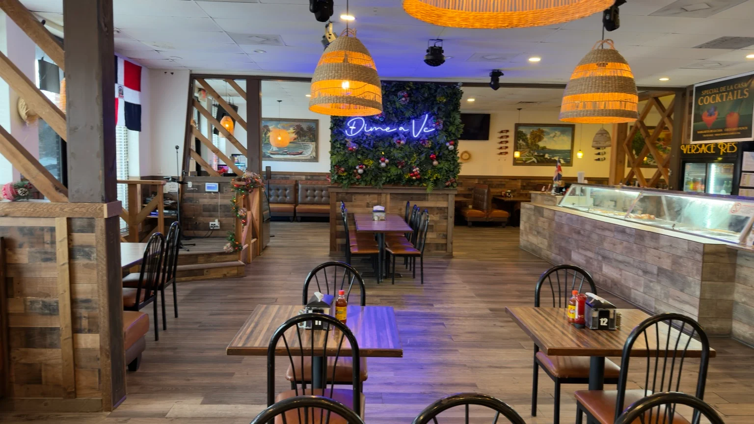 Interior of a restaurant with wooden decor and seating arrangements.