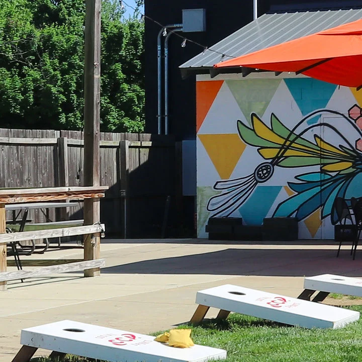 Outdoor patio with cornhole