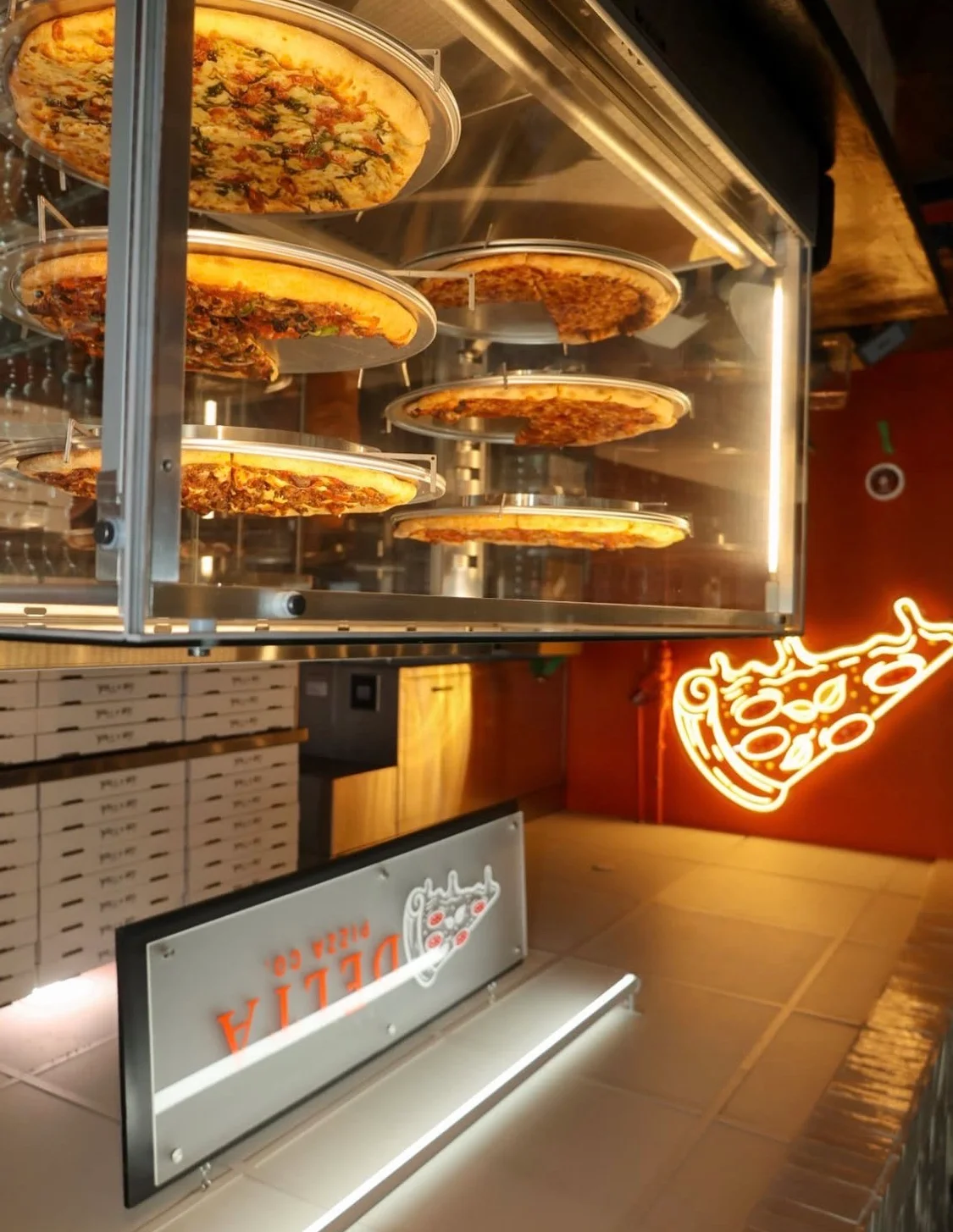 Display of various pizzas at Delta Pizza Co.